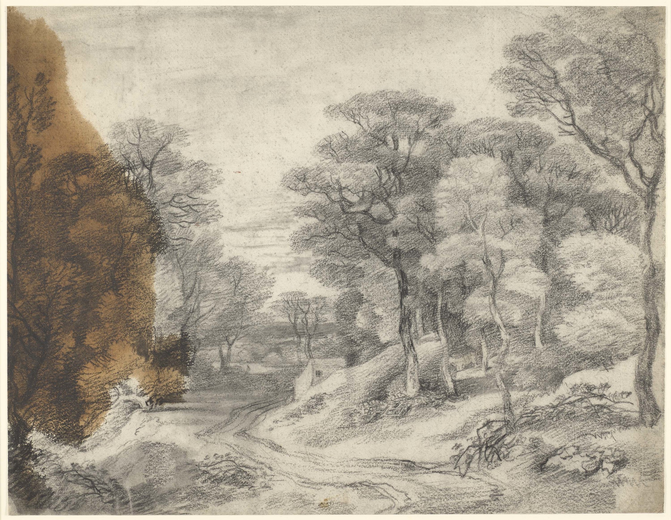A&nbsp;drawing in black chalk and stump&nbsp;of a wooded landscape with a road winding through the centre, and a small house in the middle ground centre. Large oil stain at left. 
This drawing is one of 25 landscape drawings in the Royal Collection that w