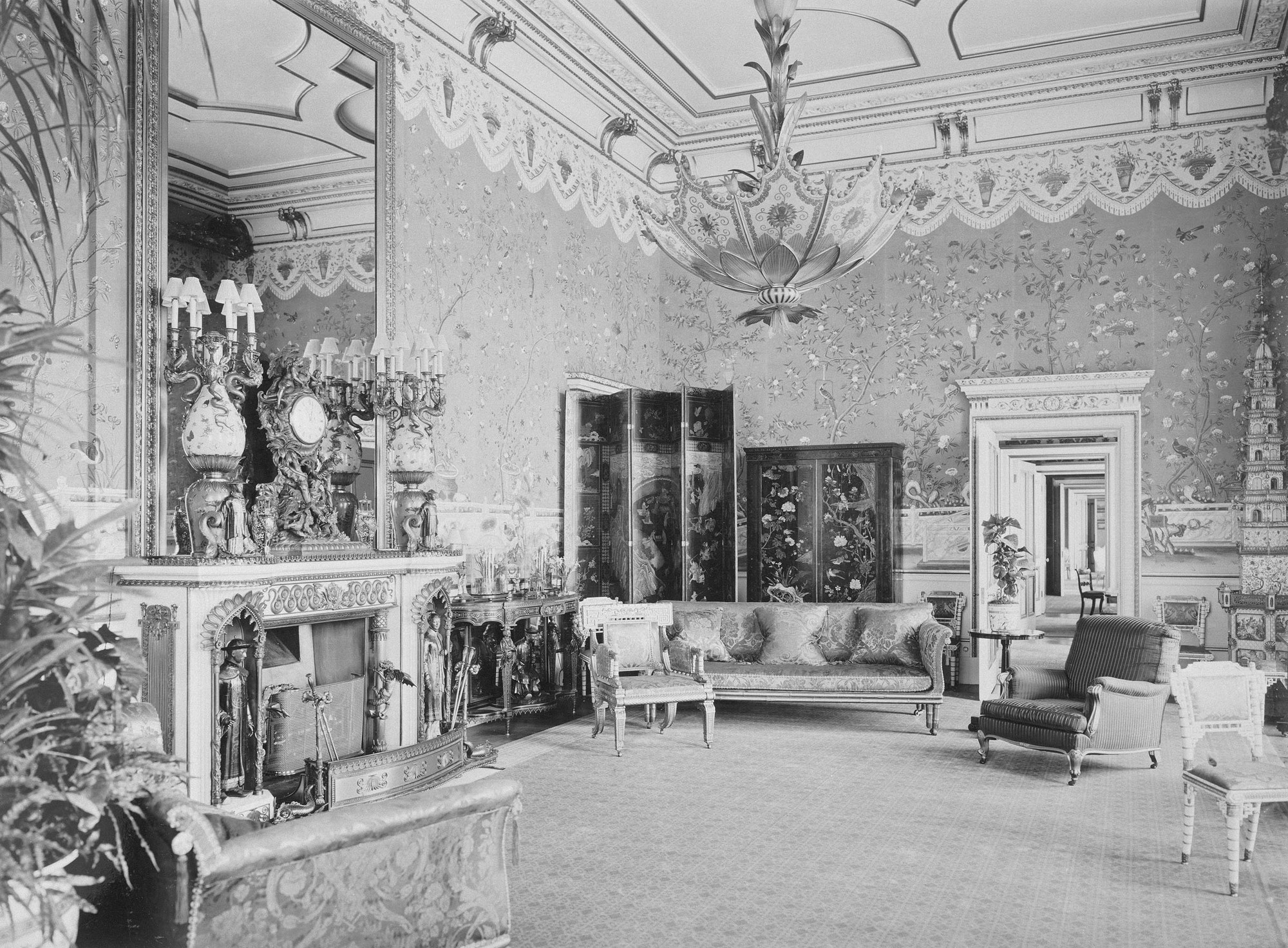 The Yellow Drawing Room, Buckingham Palace. Comprises fireplace, clock, chandelier, chairs and sofa, all originally from the Royal Pavilion at Brighton.