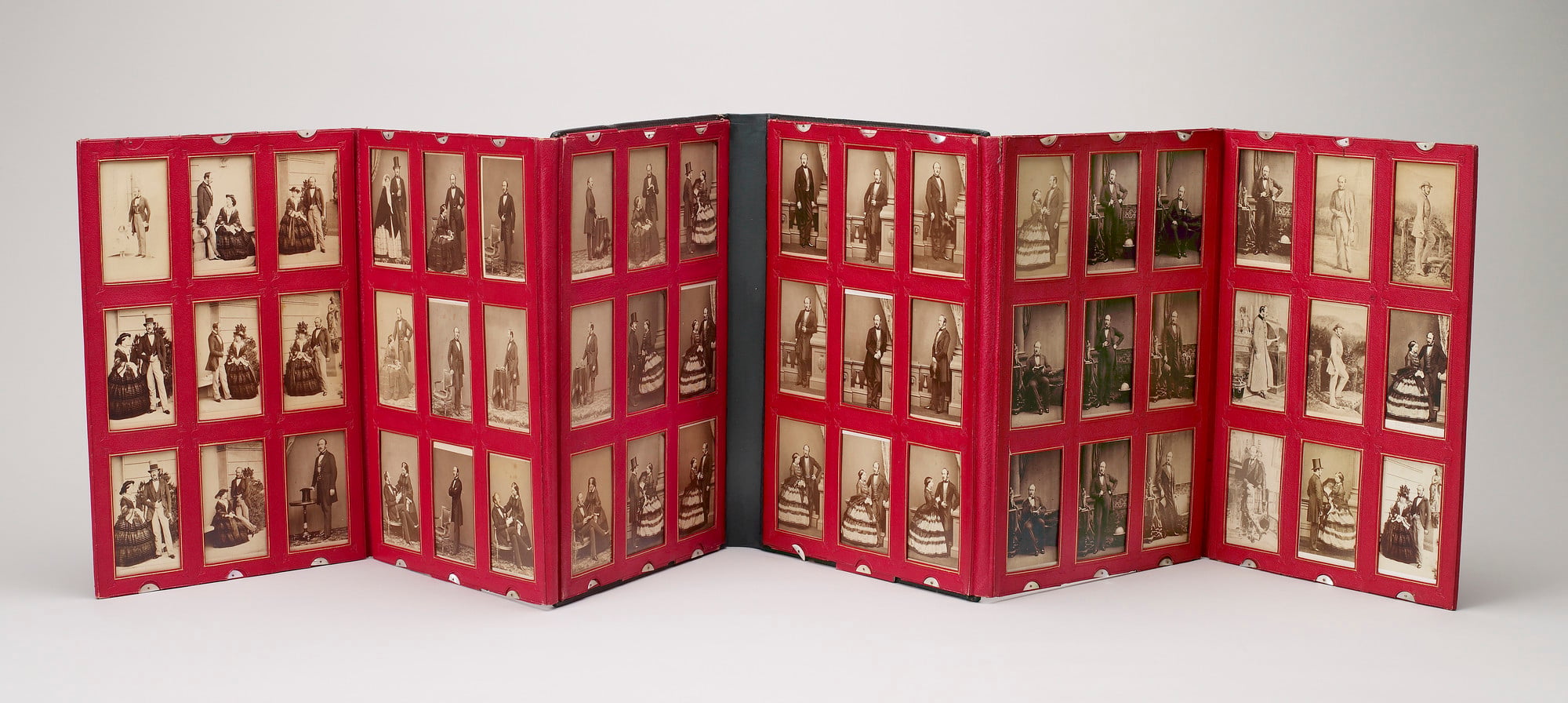 Green leather portfolio, consisting of two folding triptych screens of red paste grained leather, each window outlined in gold and finished in blind, with mother of pearl clips, containing 54 albumen cartes-de-visite (RCINs 2914921-2914971 plus 2105656, 2