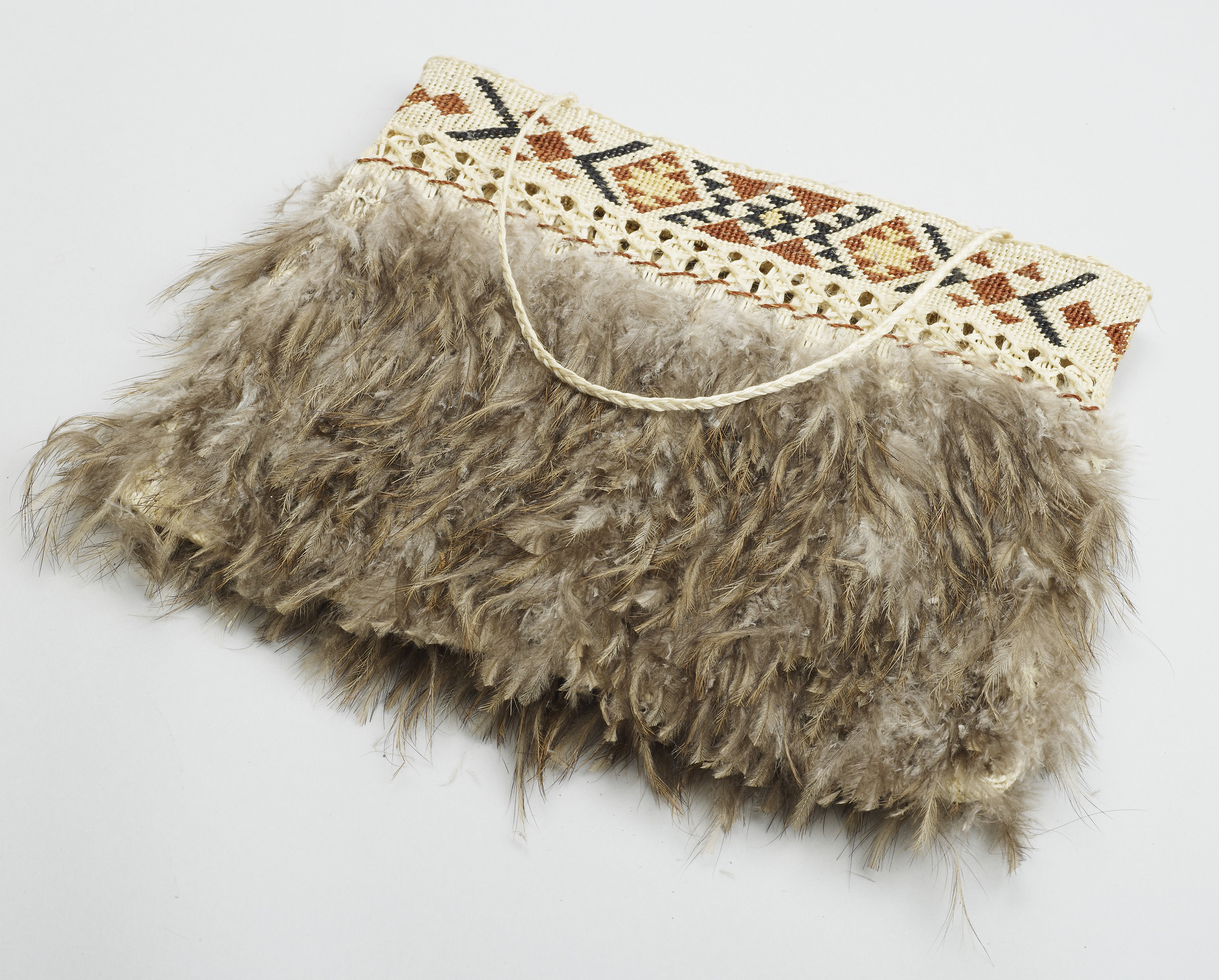 A Maori bag made of flax and kiwi feathers. The kiwi bird holds a special significance for the Maori - it is symbolic of elder brothers and sisters, representing their protective spirits.


During a visit to New Zealand in October 1981, the Te Atiawa p