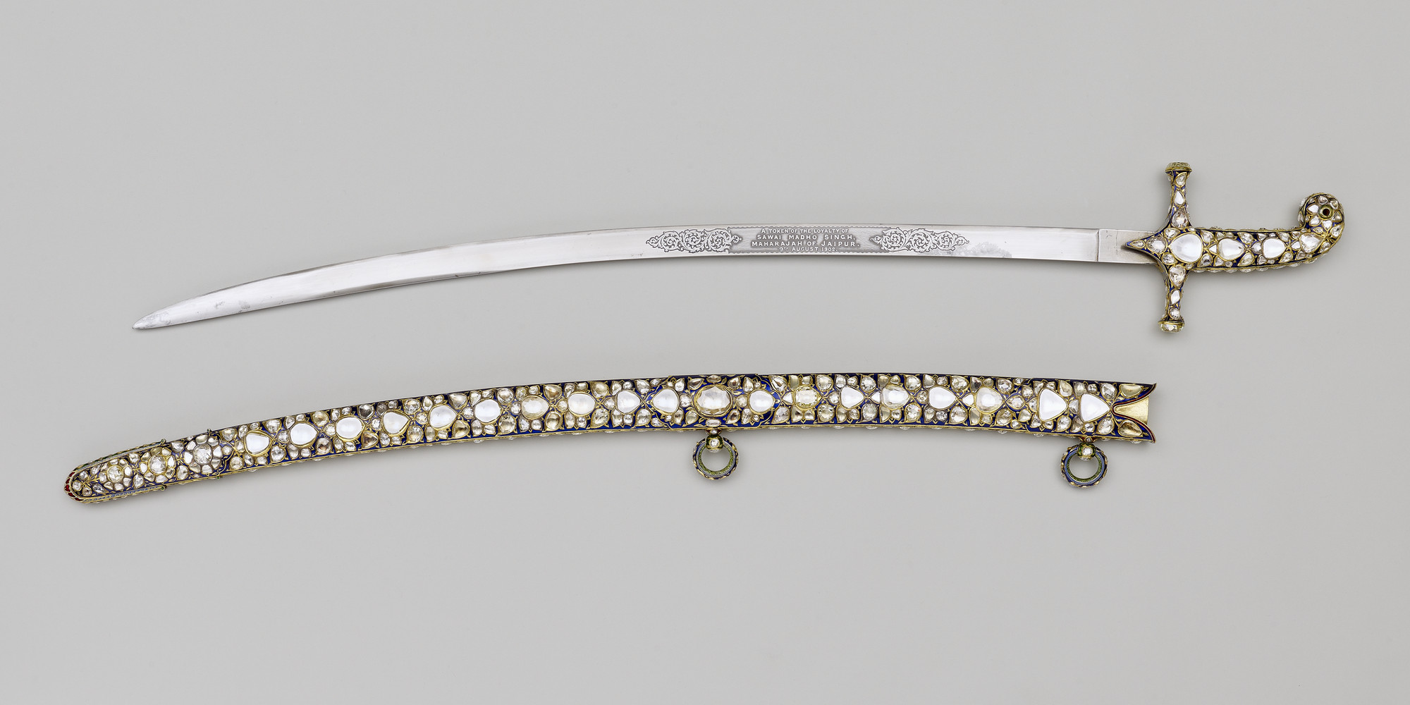 This exceptionally rich sword and scabbard were presented to Edward VII on the occasion of his coronation by Sawai Sir Madho Singh Bahadur (1861-1922), Maharaja of Jaipur, one of the small group of Indian princes and nobles invited to attend the ceremony 