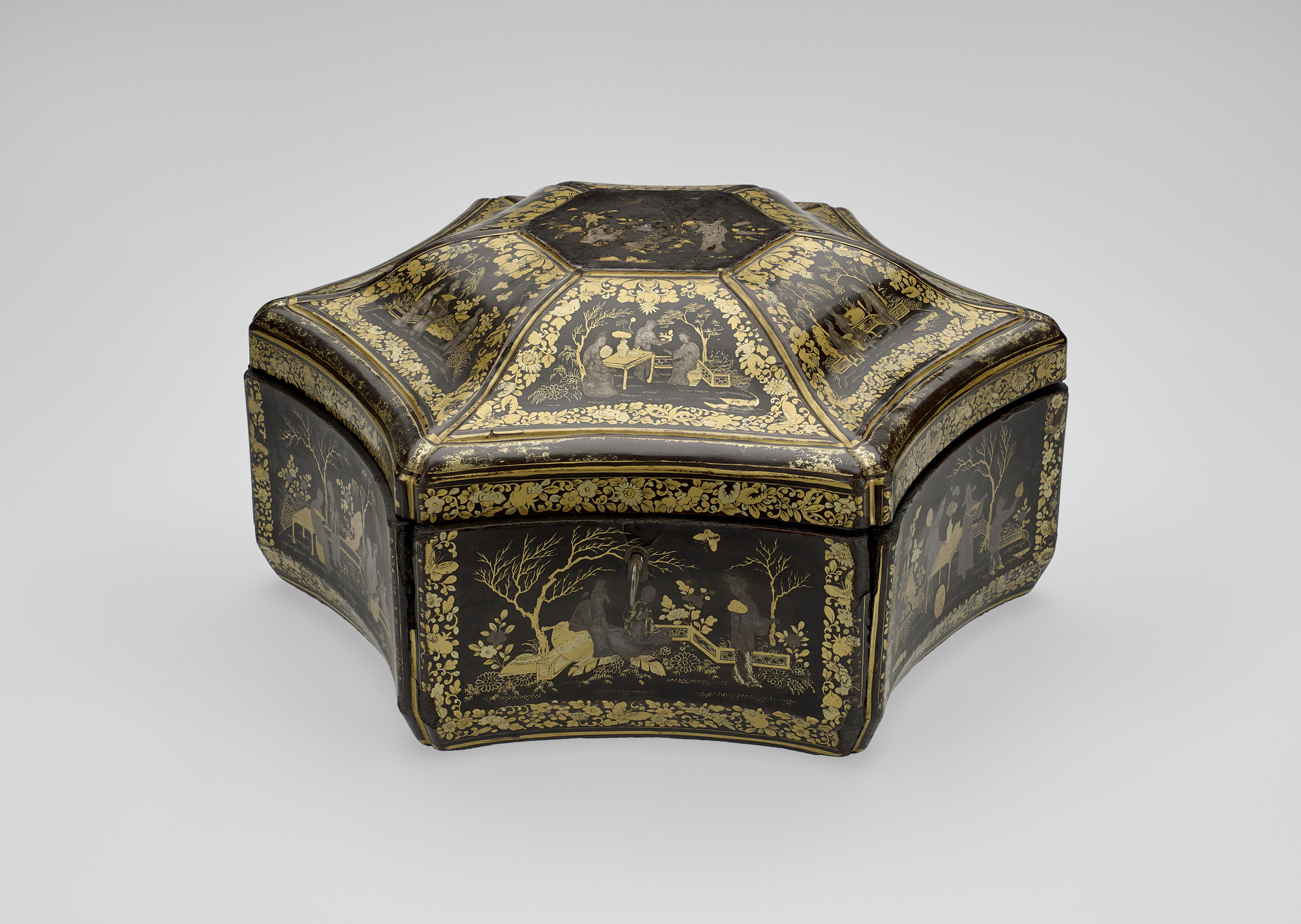 Tea caddy Tea caddy box. Of six-pointed star shape, with concave sides, the deep hinged top with a flat, hexagonal centre, and six curving ribs outlining its hollowed sides. The interior housing two close-fitting canisters of engraved pewter, each half a star shape