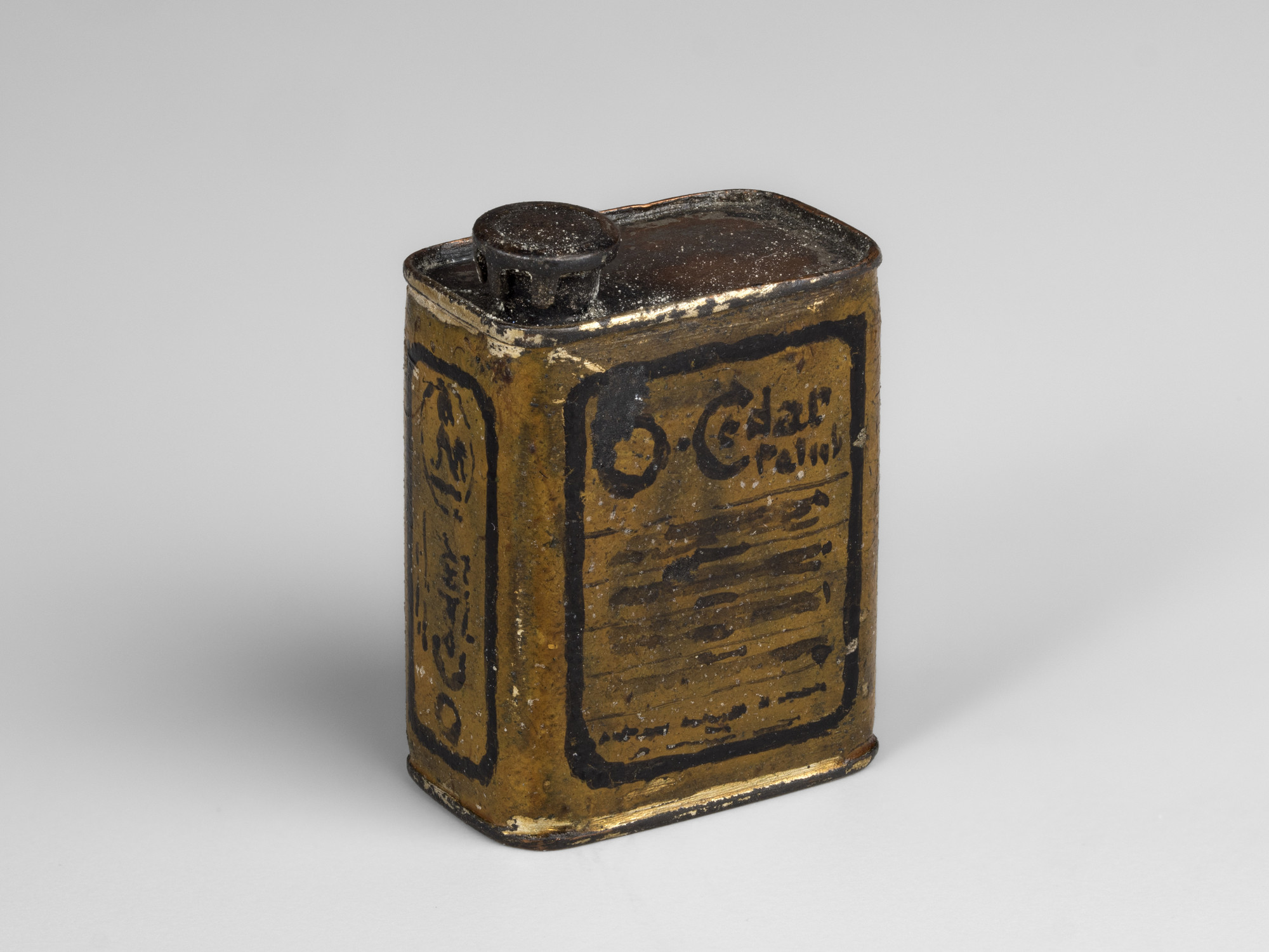 A miniature rectangular tin of O'Cedar polish