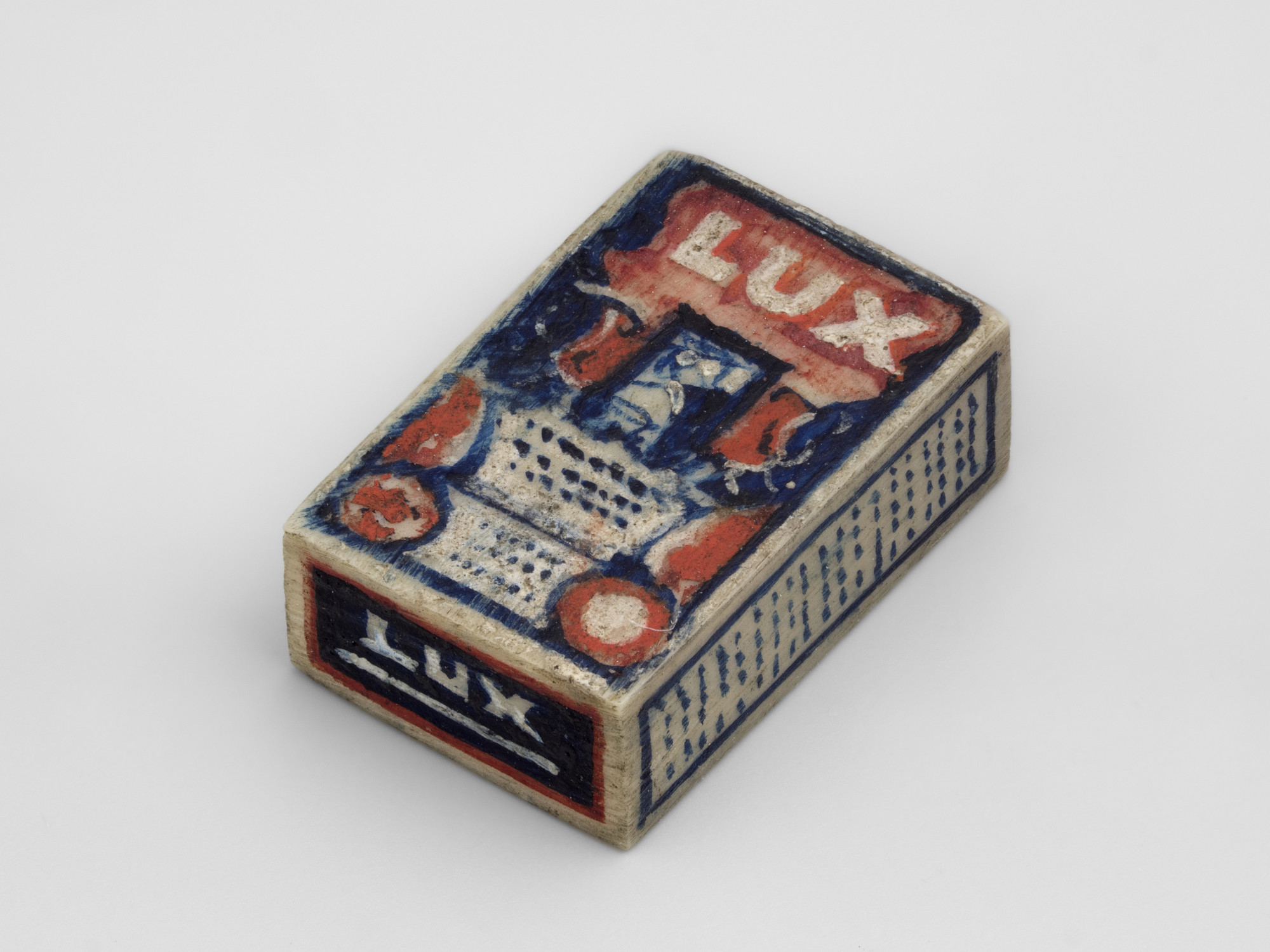 Miniature wooden box painted as if with labels of Lux soap flakes