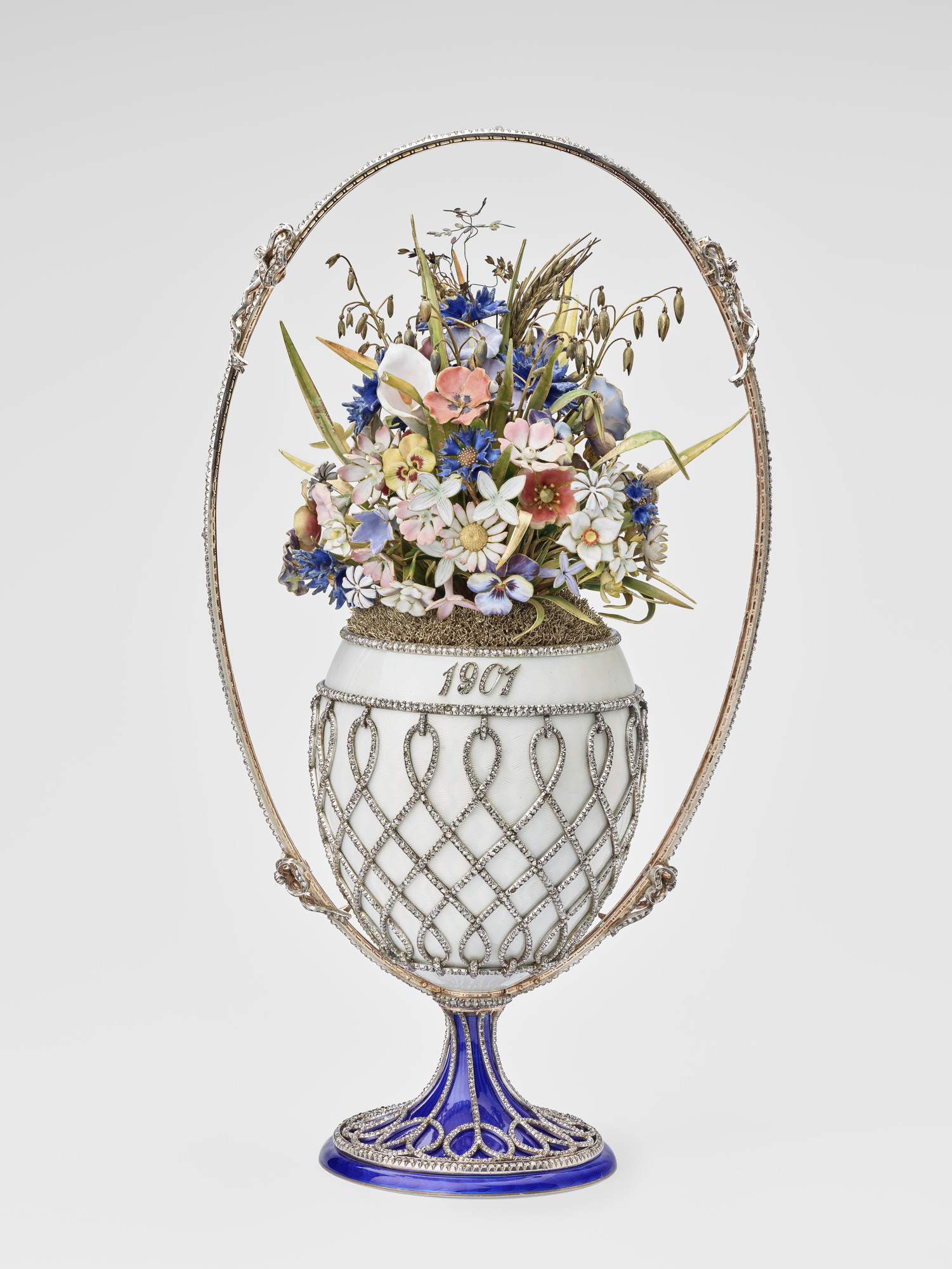 Imperial Easter egg, basket-shaped, silver-gilt and oyster guilloch&eacute; enamel mounted with rose diamond trellis and oval handle with four bows, blue enamel splayed base with rose diamond trellis. Egg contains wild flowers, leaves and husks of enamel 