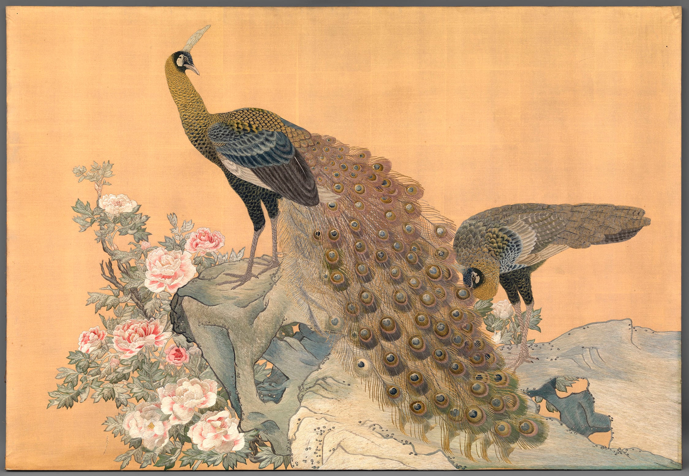 This design of a peacock and peahen with a tree peony is based on a painting on silk by Maruyama Ōkyo (1733&ndash;95) dated 1771. The peacock, a perennially popular subject with embroiderers, is representative of spring, particularly in combination with 