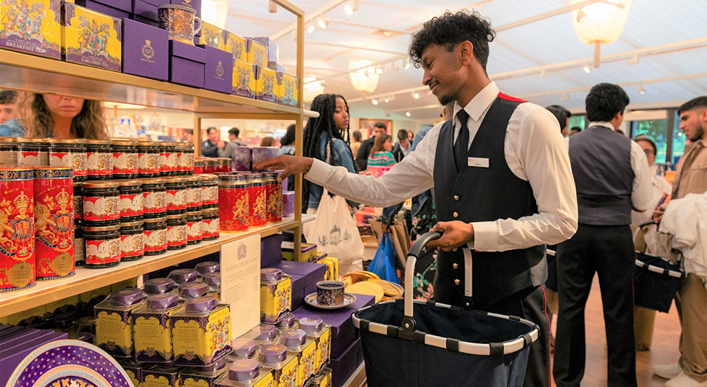 Our retail assistant Ashvin in our shop. A person stacking shelves in the shop