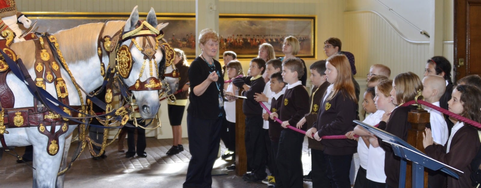 Pupils visit the Gold State Coach at the Royal Mews