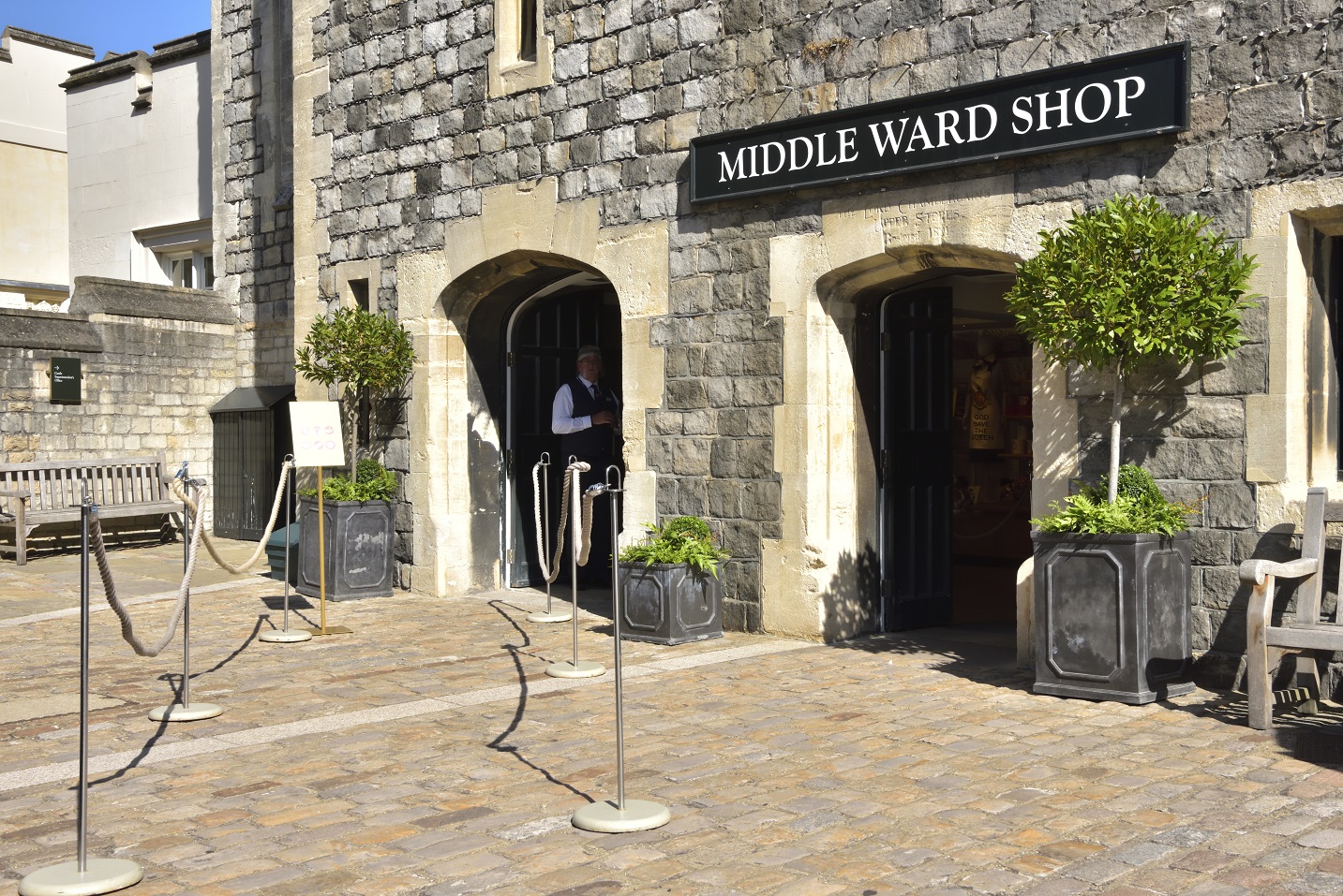 The exterior and entrance, with queuing system in to the Middle Ward shop