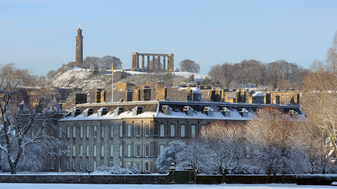 Photograph of the Palace of Holyroodhouse covered in snow