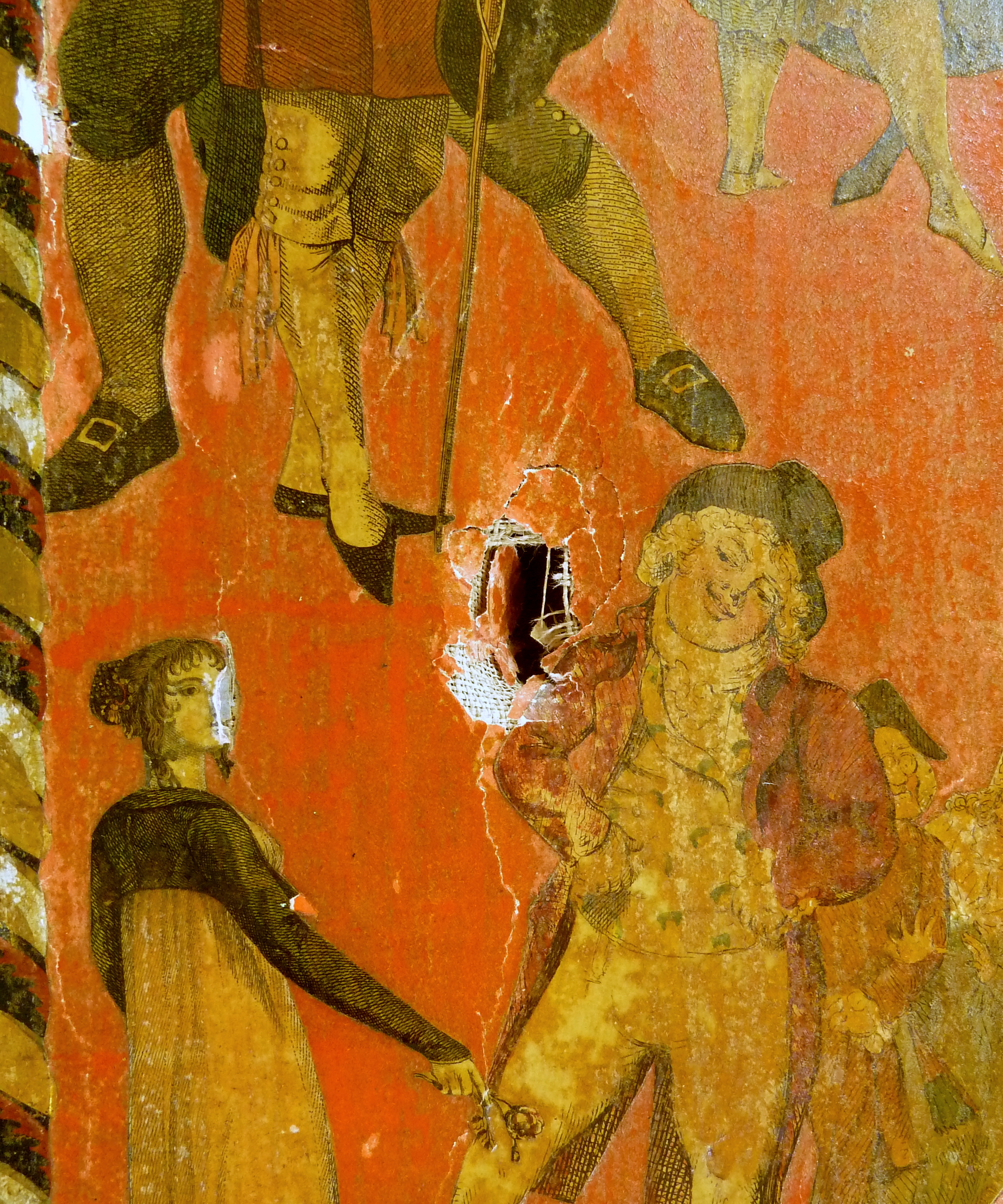 Puncture hole in one of the panels, pre-conservation