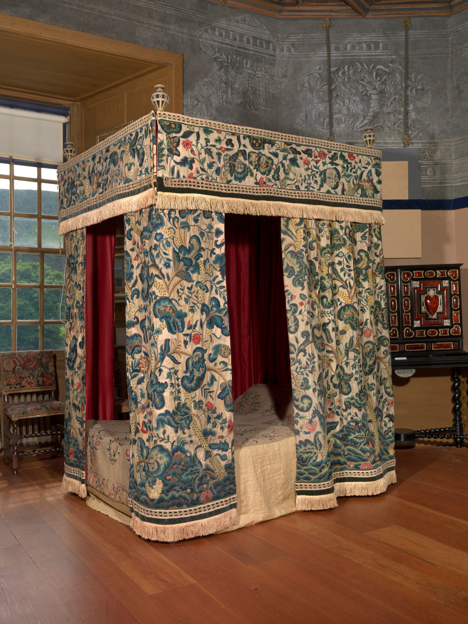The four-poster bed in Mary, Queen of Scots' Bedchamber with old bedhangings