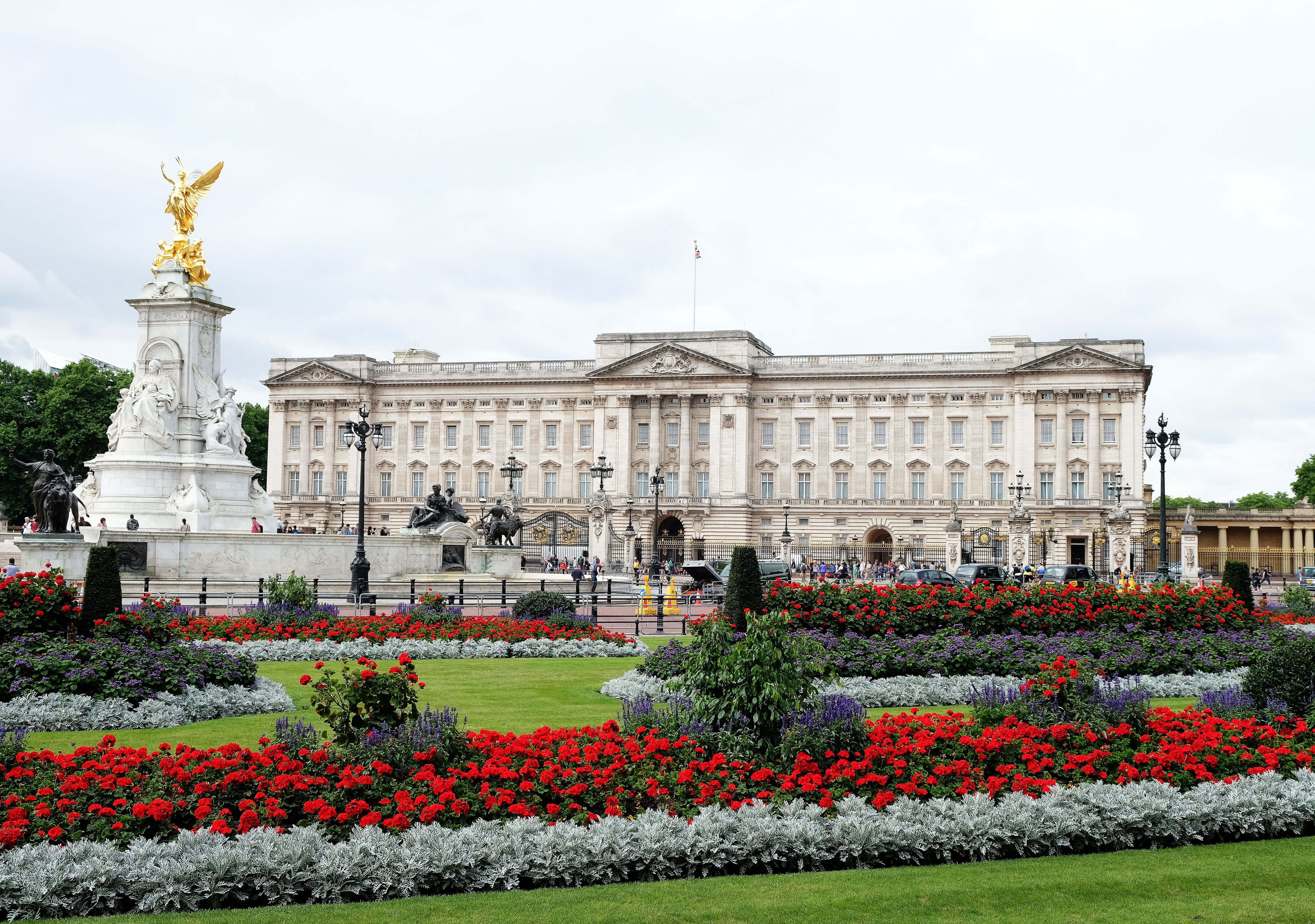 View of Buckingham Palace from front with flowers in the foreground