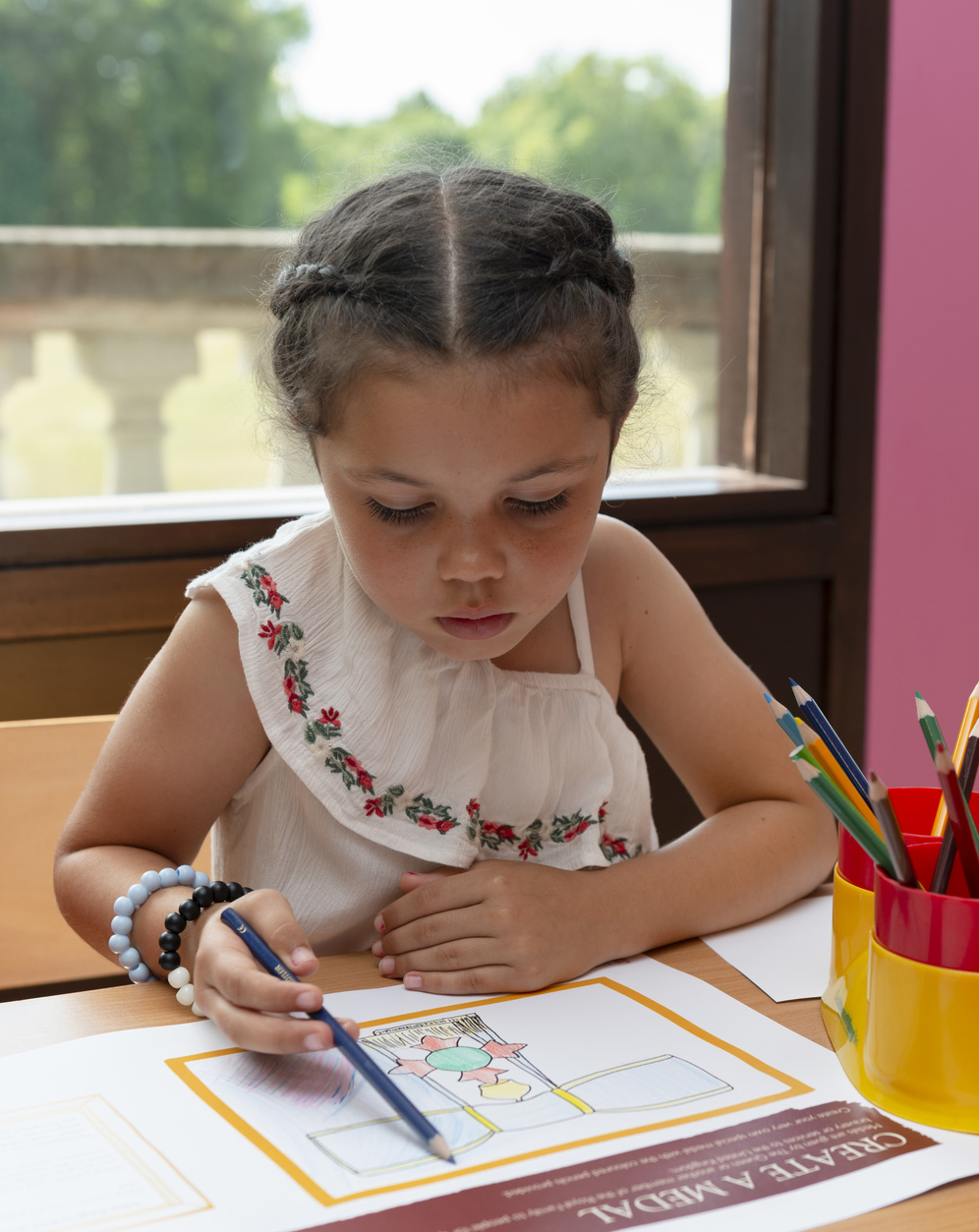 Child draws while in the family pavilion