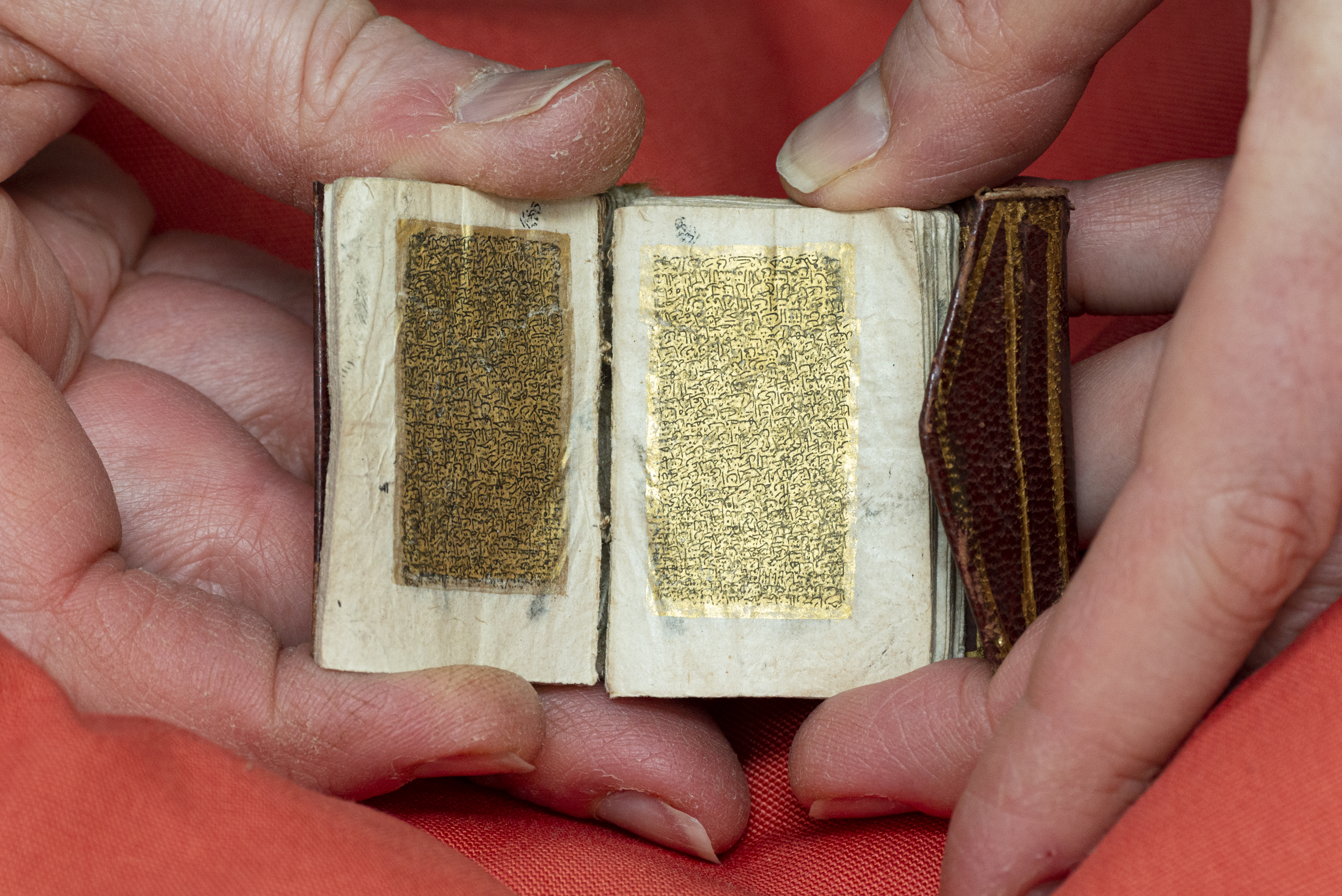 gold Quran manuscript pages