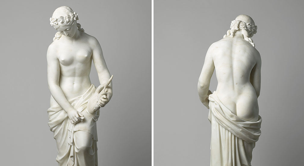 Marble statue of poet Sappho by William Theed (RCIN 2079) A white statue of a woman partially dressed with draperies gathered around her hips and wearing a laurel wreath on her head
