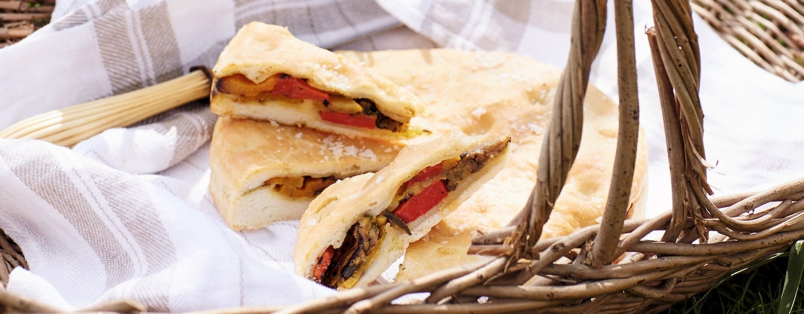 Image of grilled vegetable focaccia in a picnic basket