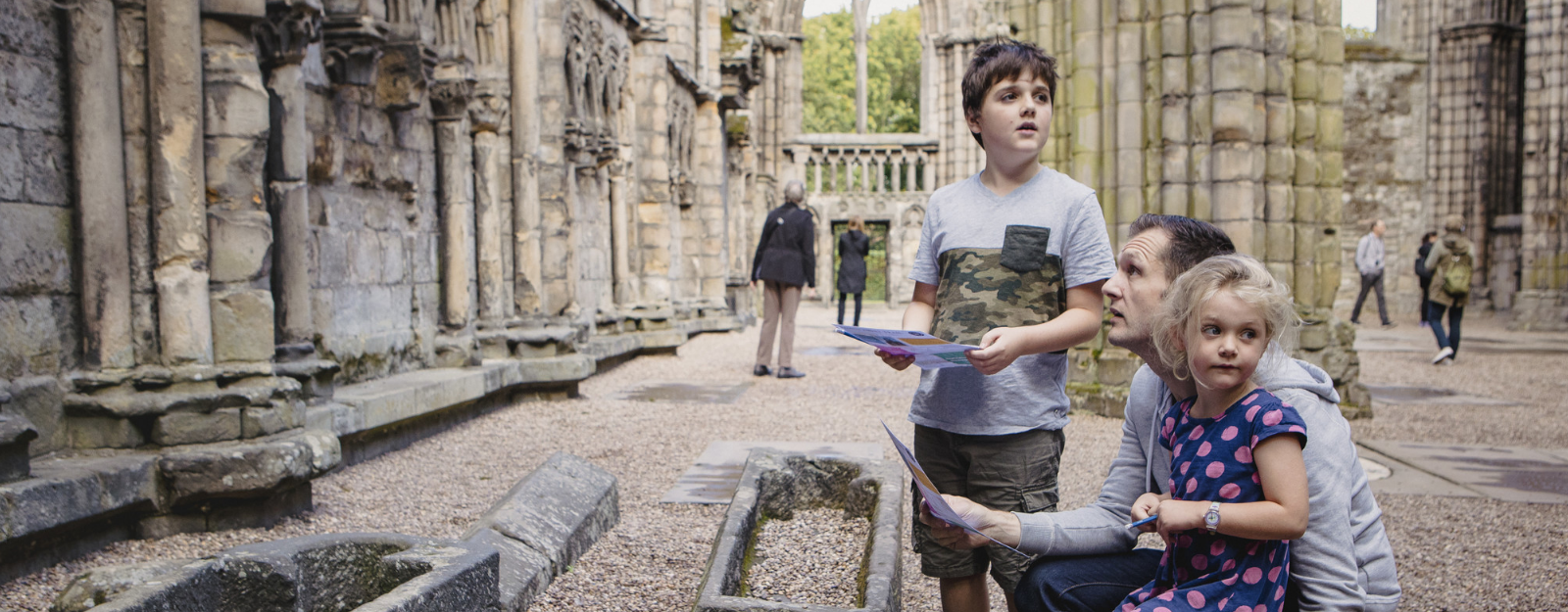 Family exploring Holyrood Abbey