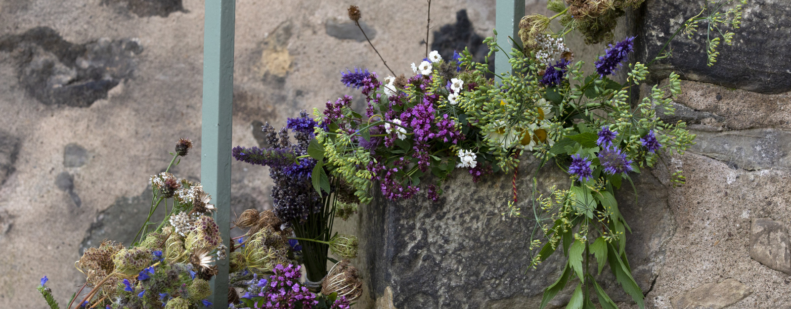 Cut flowers decorating an old stone staircase
