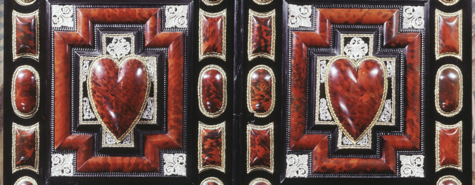 Up close detail of cabinet decorated with red hearts