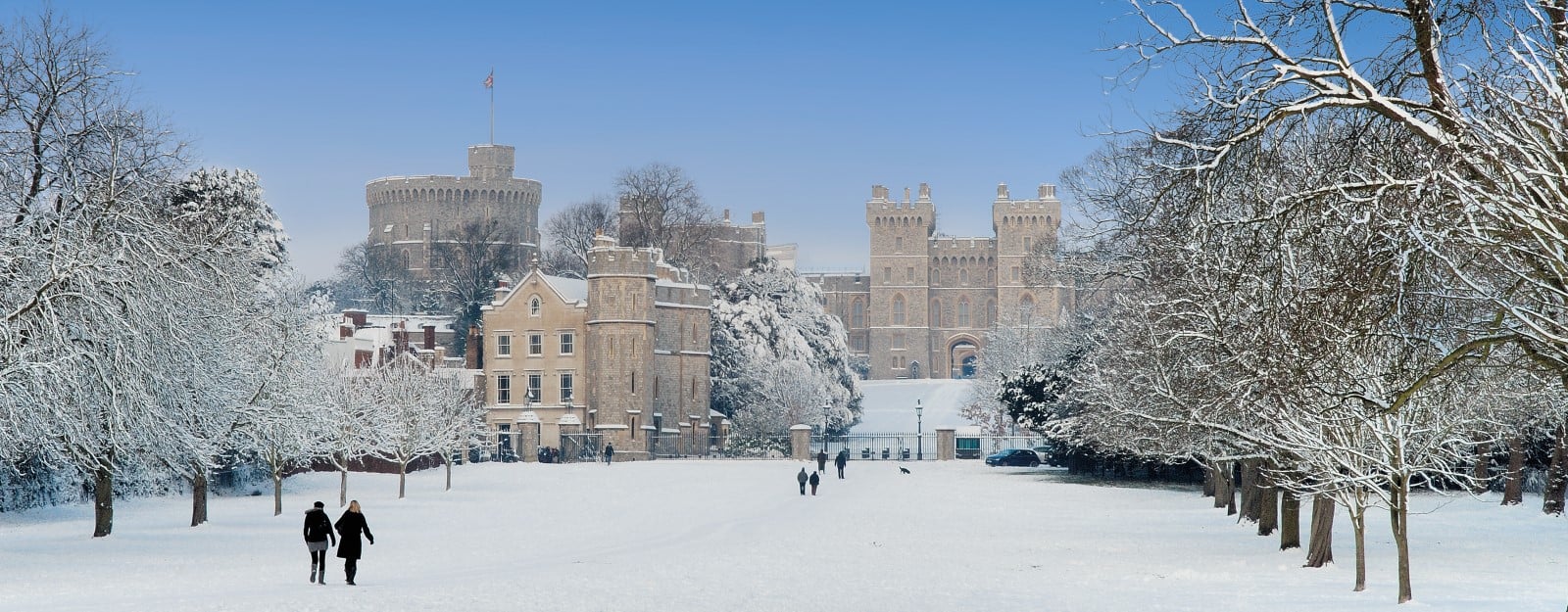 View of Windsor Castle from the Long Walk. Snow covers the ground.