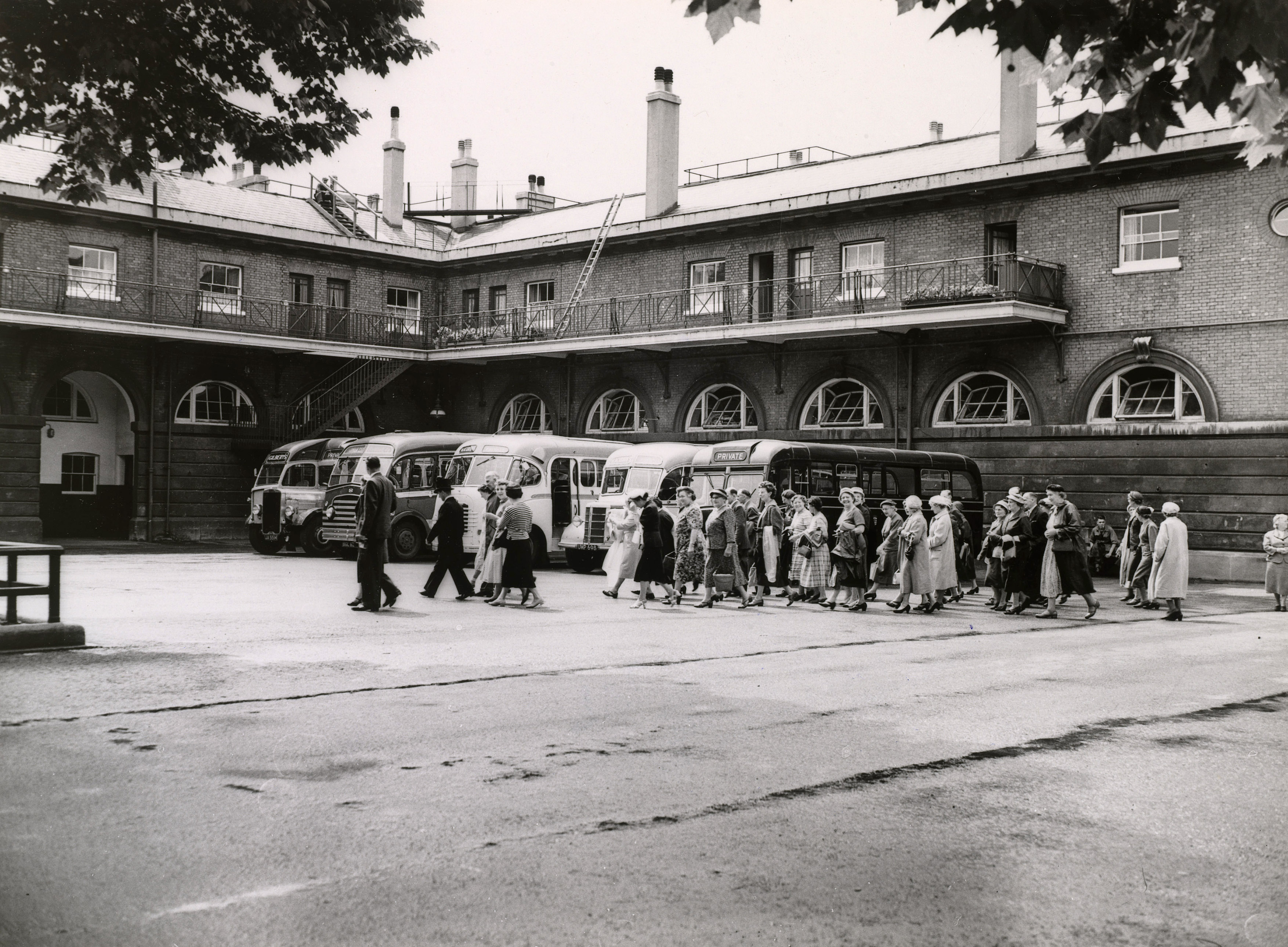 Photographs showing visitors buying tickets and touring the Royal Mews around the time of the Coronation of Queen Elizabeth II.