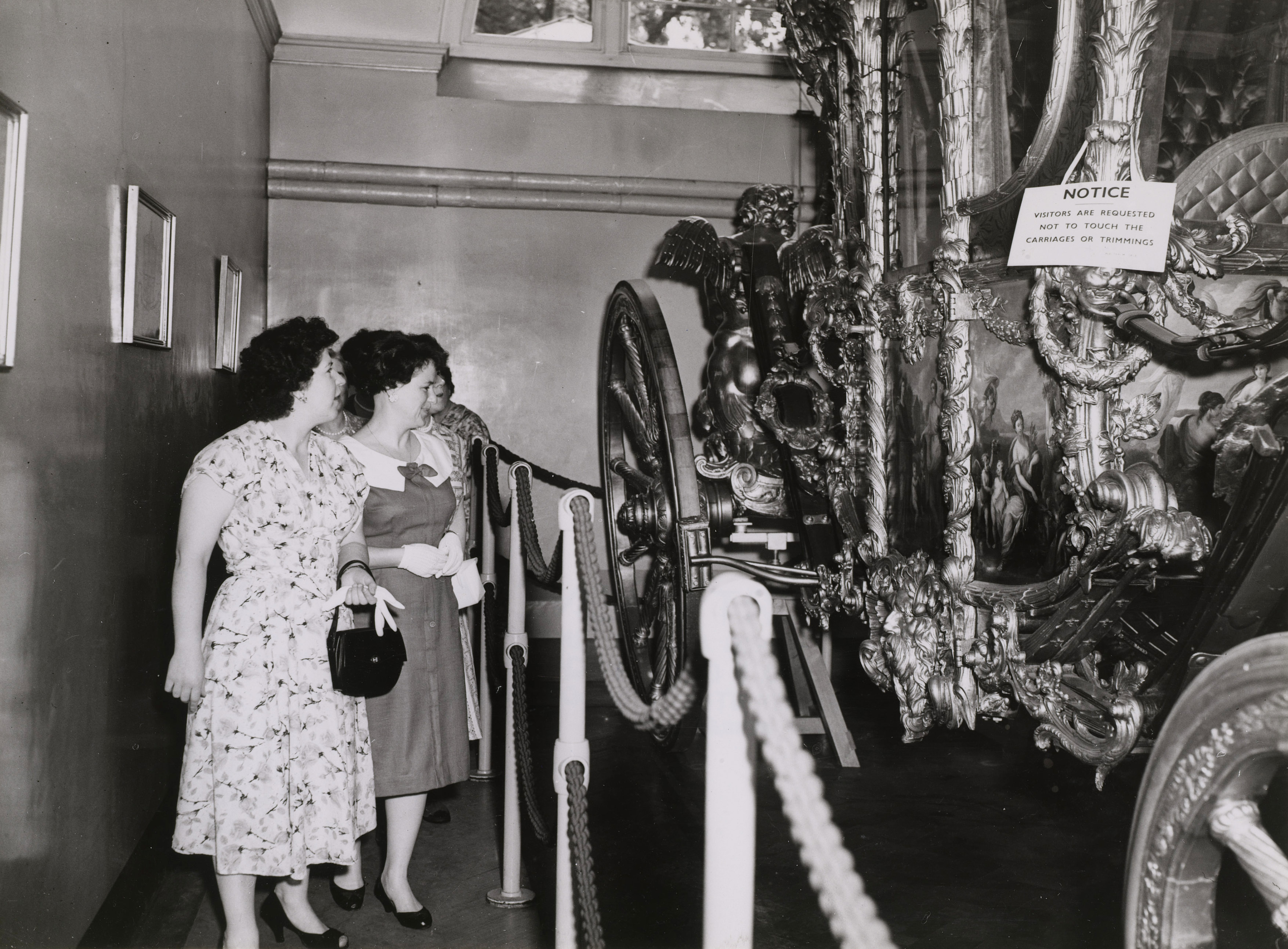 Photographs showing visitors buying tickets and touring the Royal Mews around the time of the Coronation of Queen Elizabeth II.