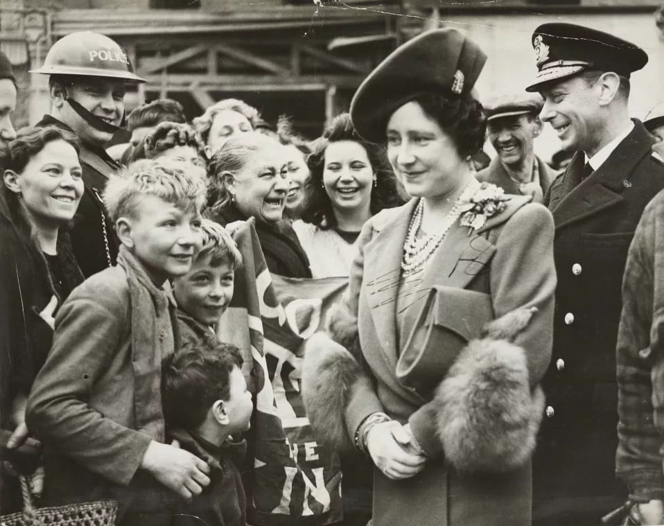 King George VI and Queen Elizabeth, 23 Apr 1941 (RCIN 2000506) A photo of George VI and Queen Elizabeth meeting women and children of bomb damaged areas of the East End of London.