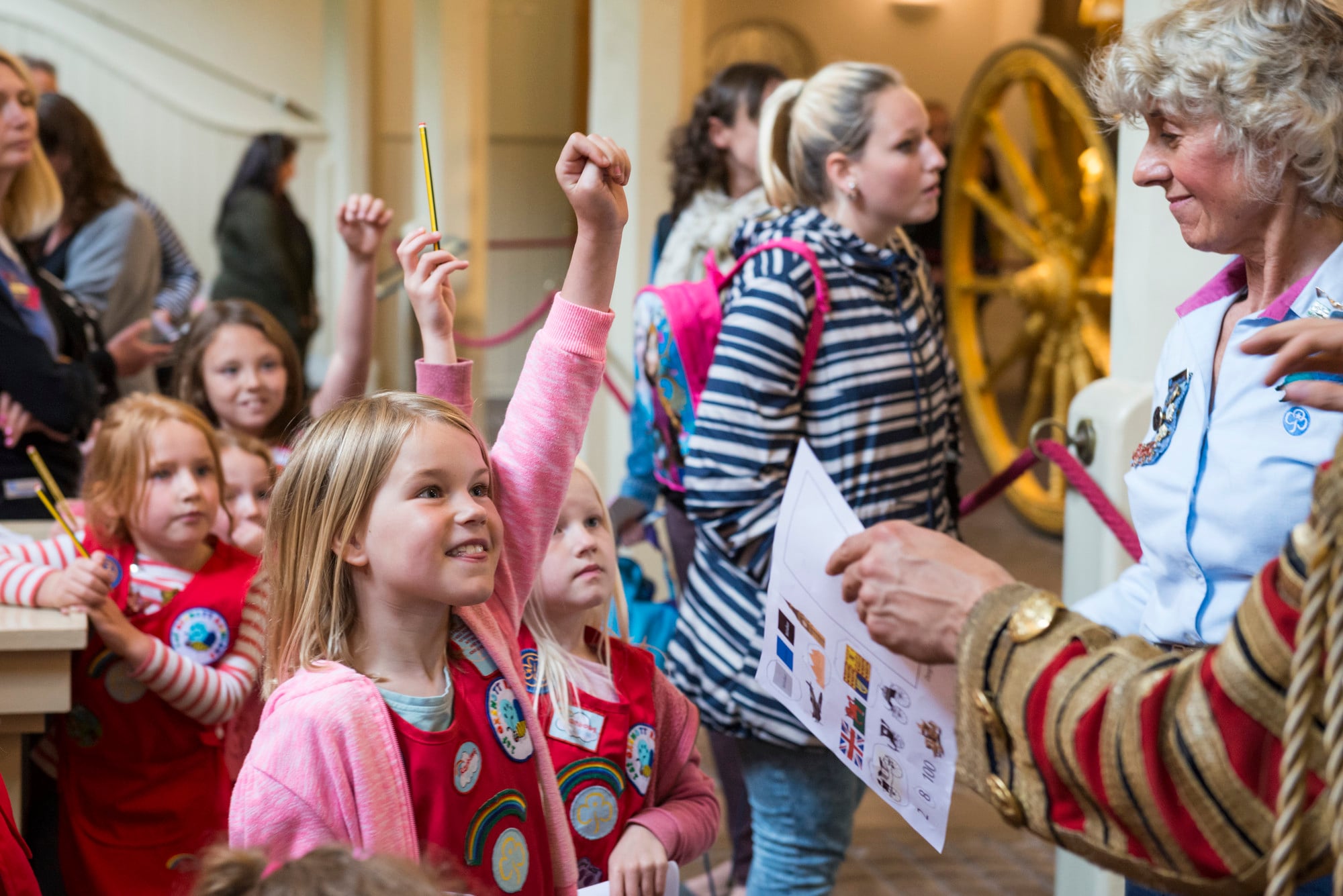 Children at the Royal Mews smile and take part in a paper trail