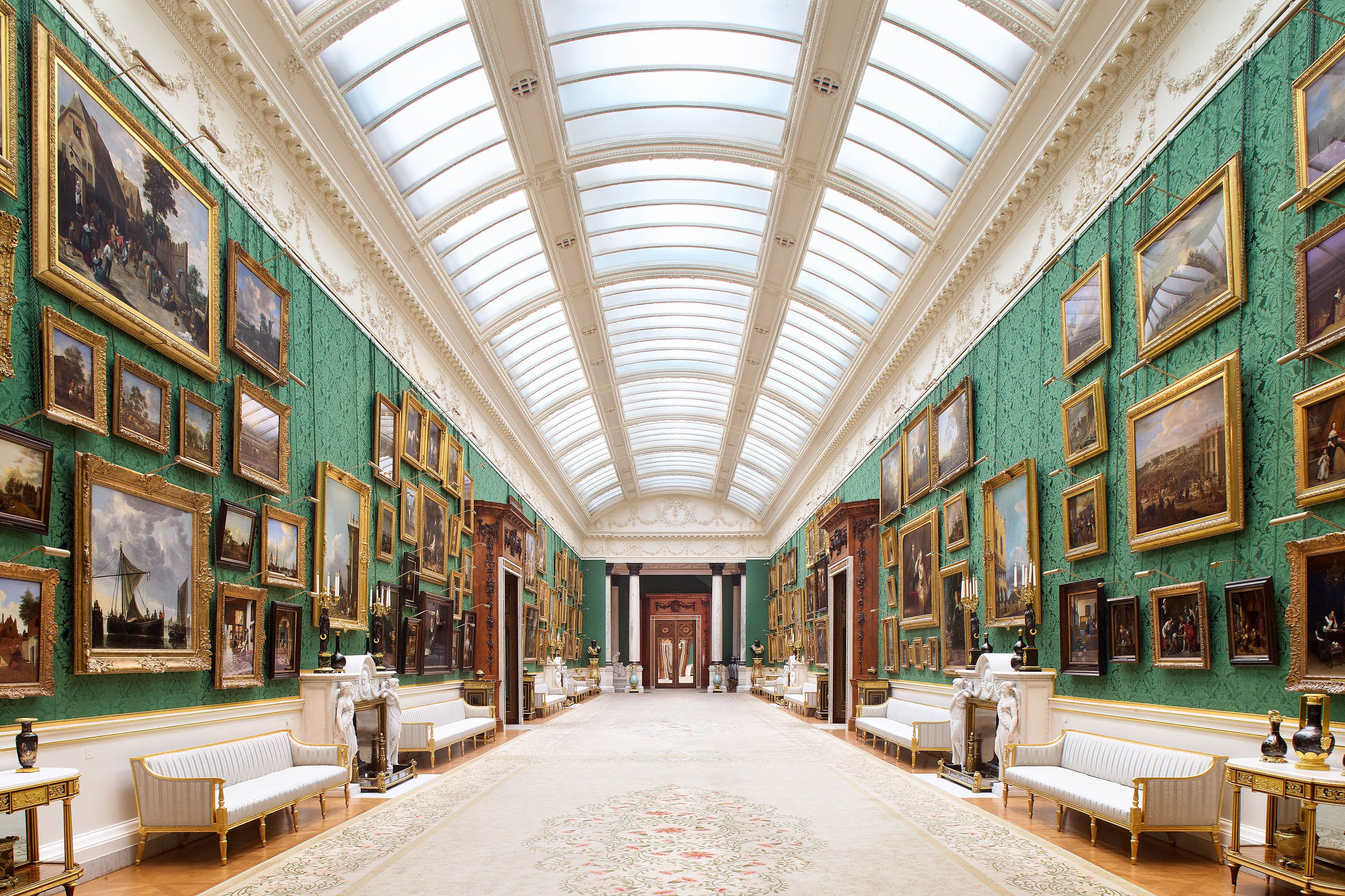 The newly rehung Picture Gallery in Buckingham Palace, which has paintings covering its emerald green walls