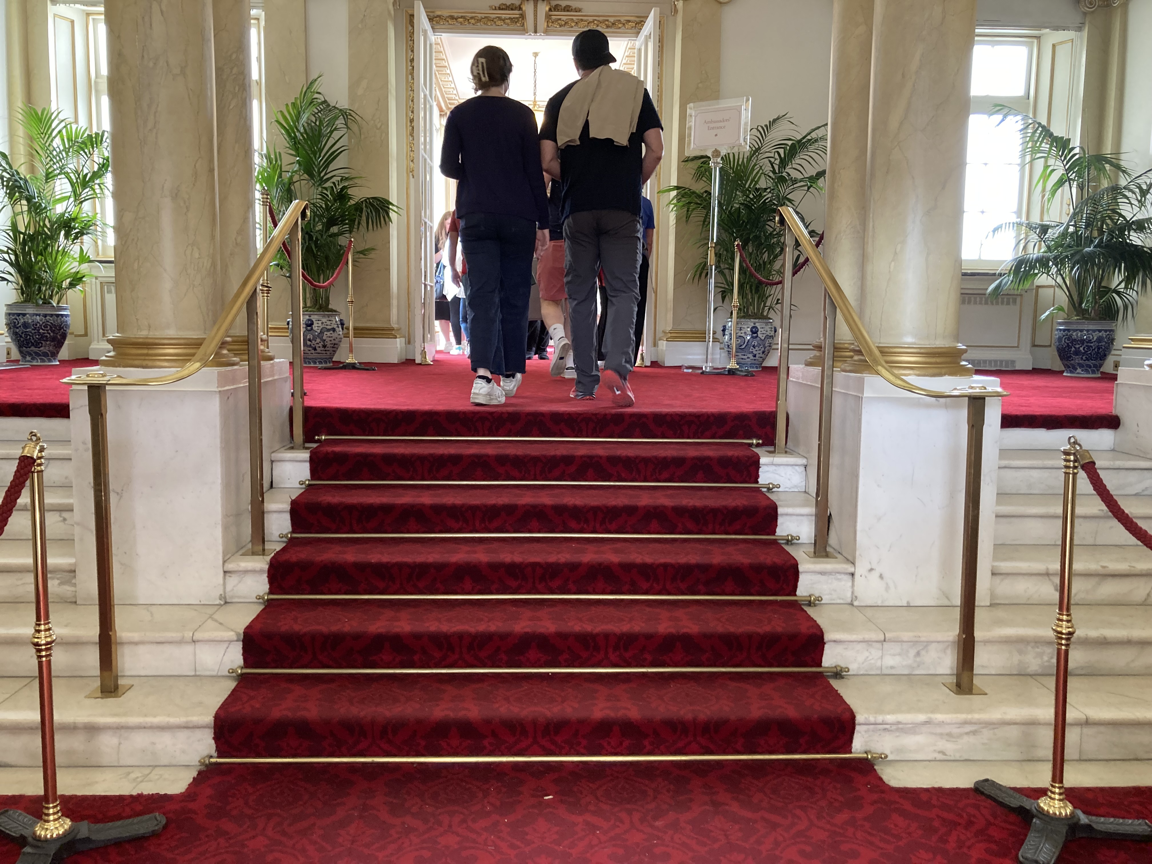 Six red, carpeted steps up in Buckingham Palace
