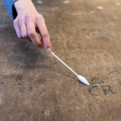 Detail of the 'CR' branding discovered on the reverse side of Artemisia Gentileschi's 'Susanna and the Elders' during conservation treatment.