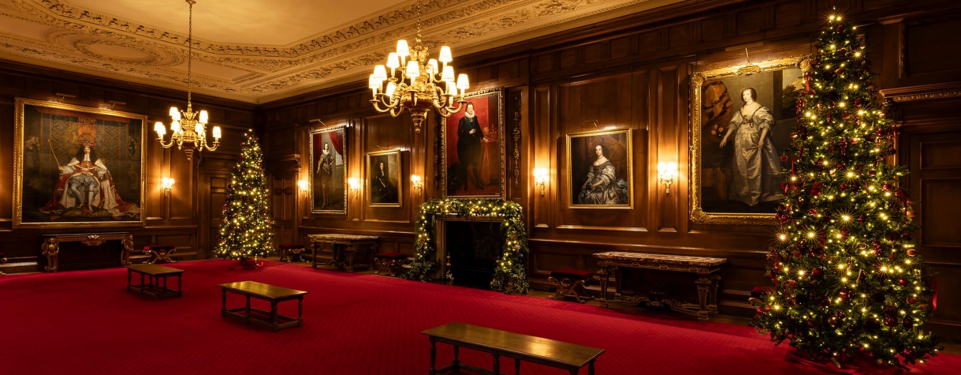 Two Christmas trees in a historic interior