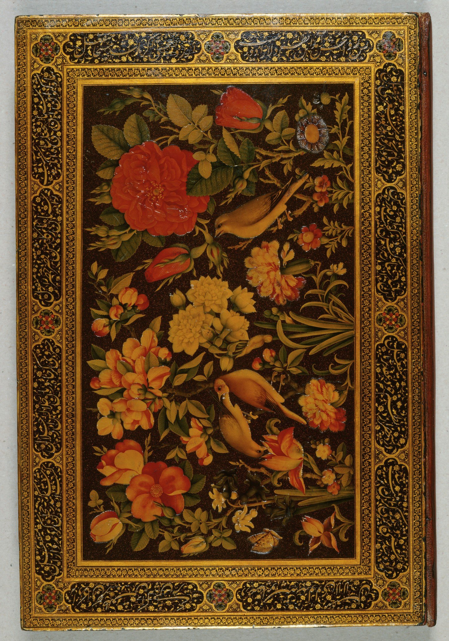 The ornamented binding of the Divan-i Khaqan showing flowers and birds.