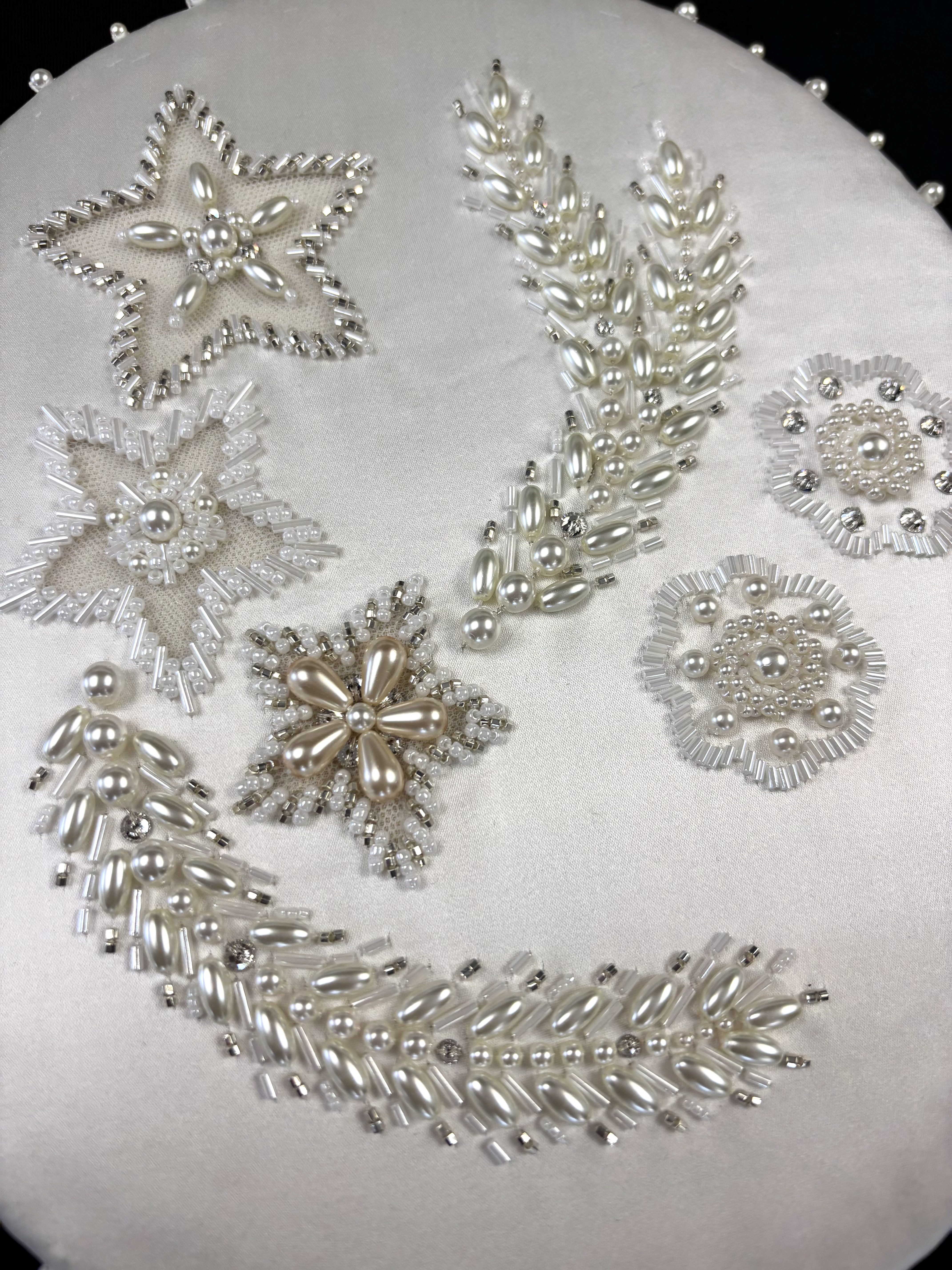 Embroidered motif designed by RSN tutor Claire de Waard, inspired by Queen Elizabeth II's Wedding Dress