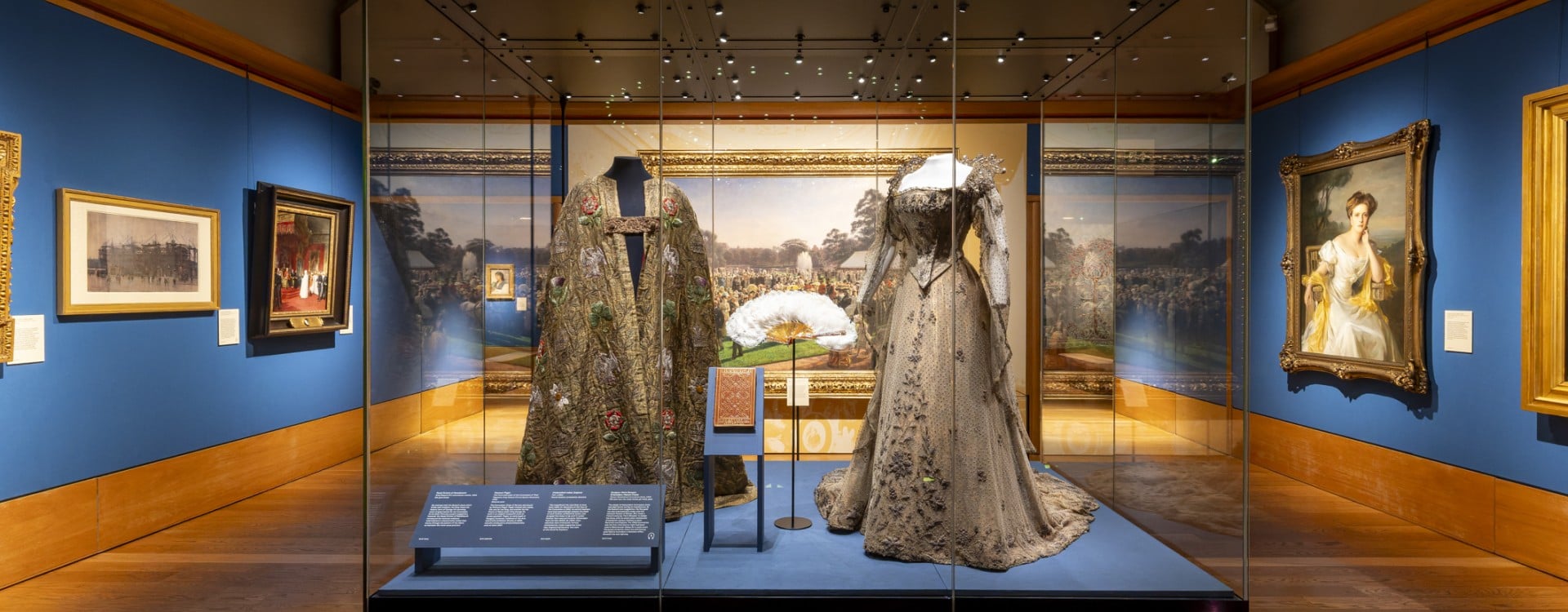 Clothing and paintings on display in the exhibition The Edwardians: Age of Elegance