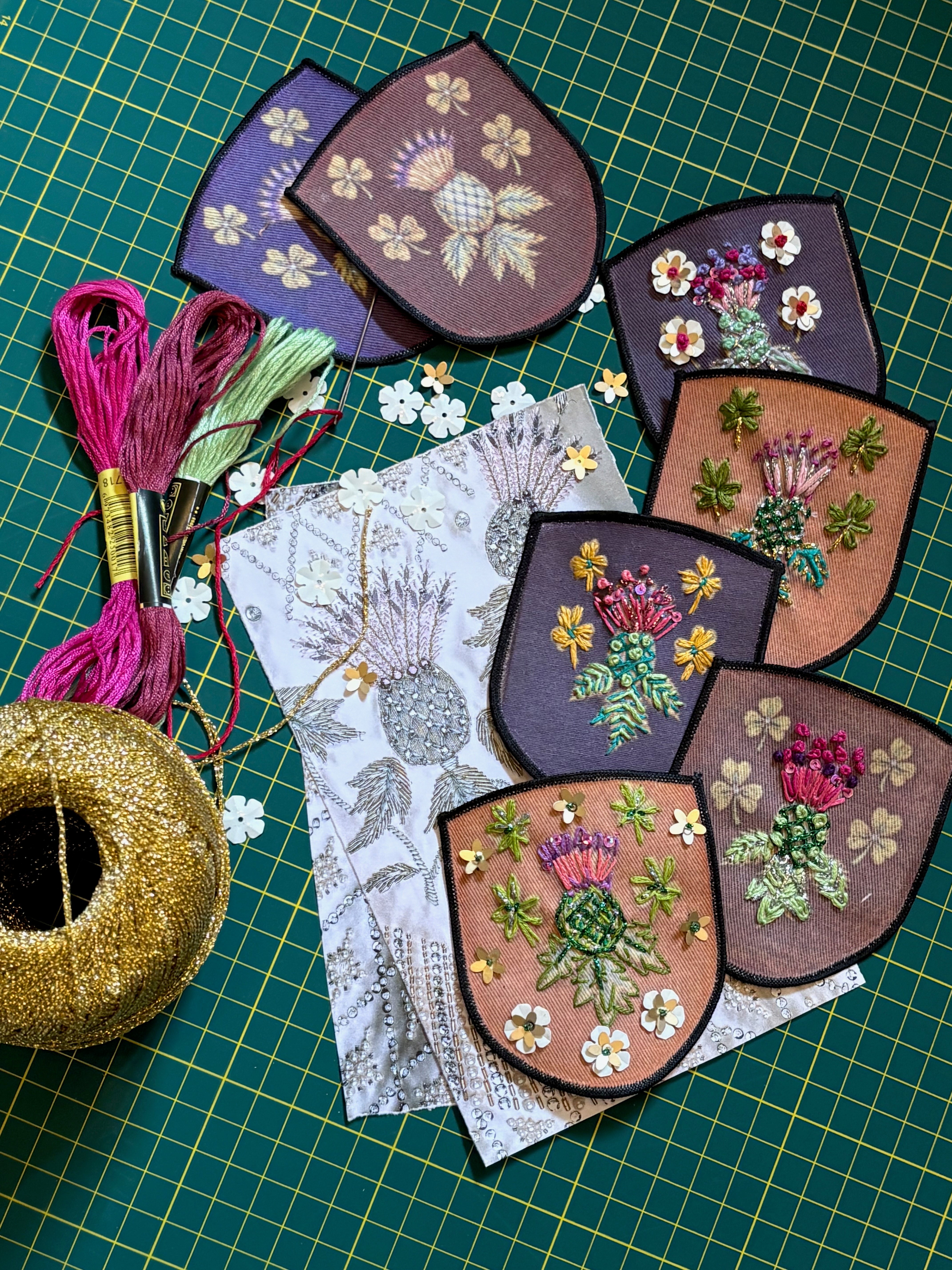 Image showing some of the completed patches, along with gold thread and loose sequins