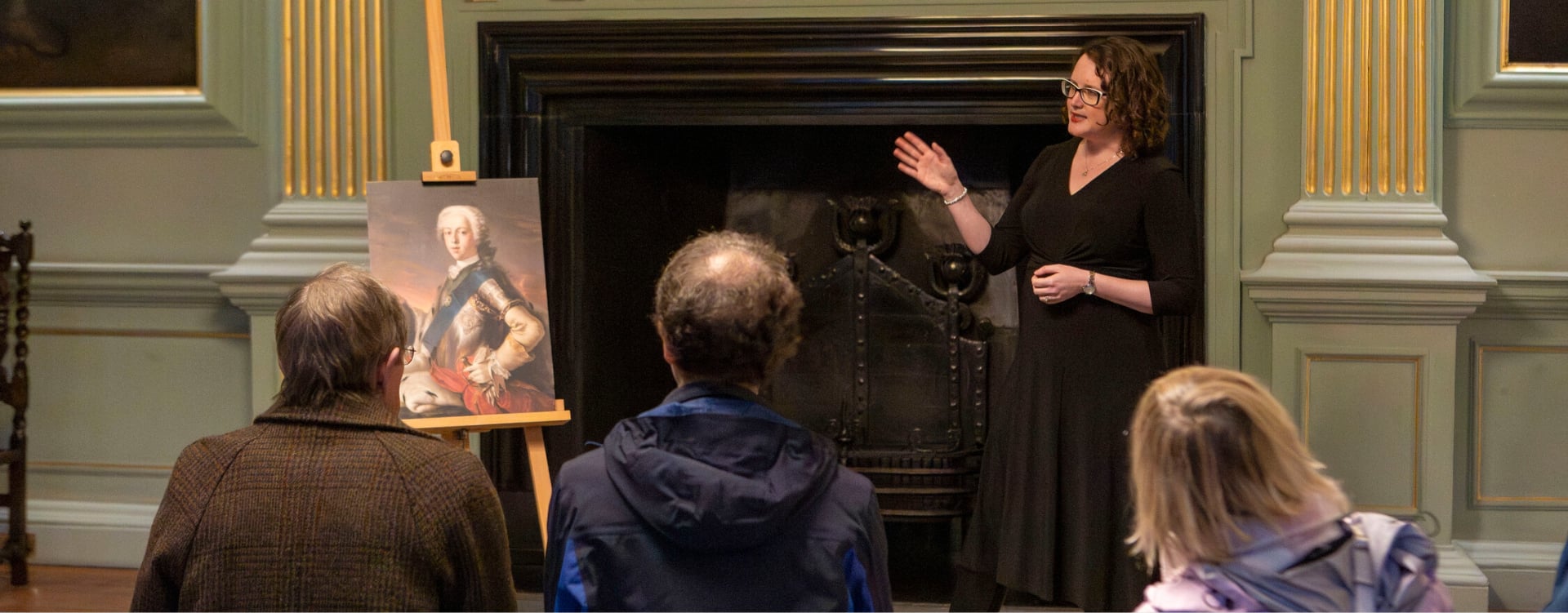 A woman giving a talk to a group of people