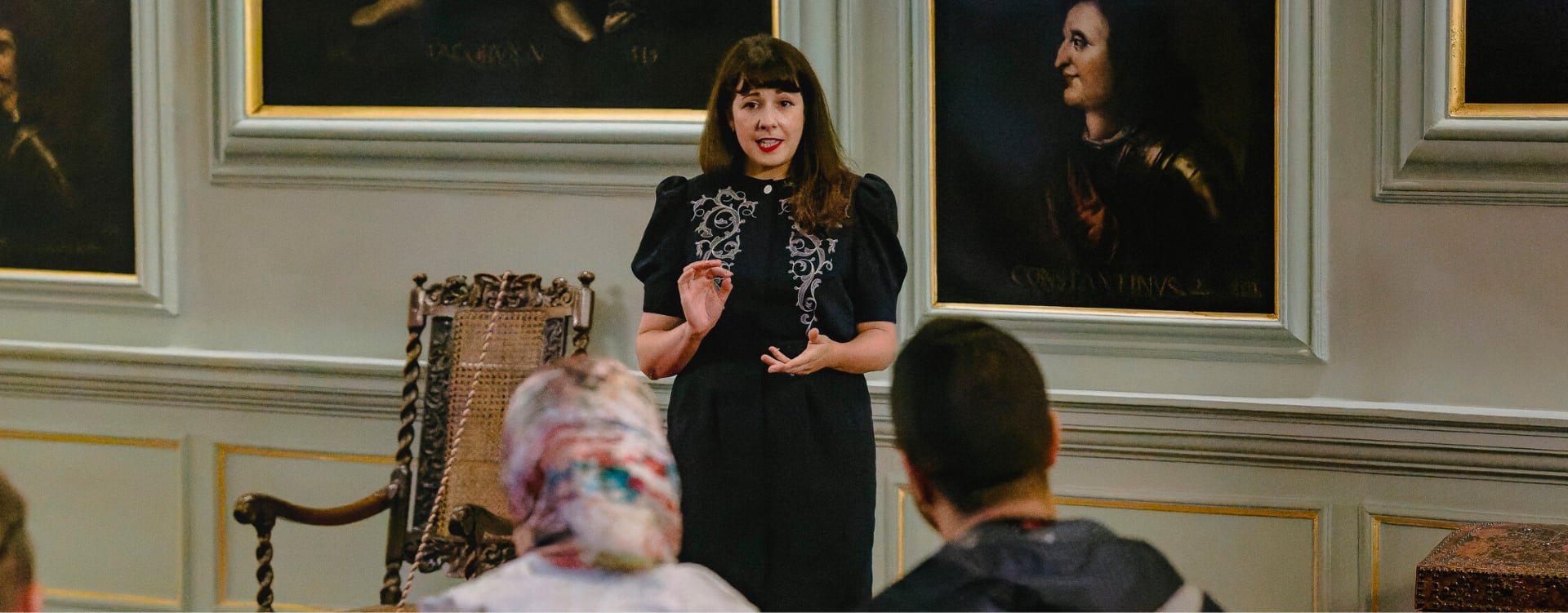 A woman giving a talk to a group of people