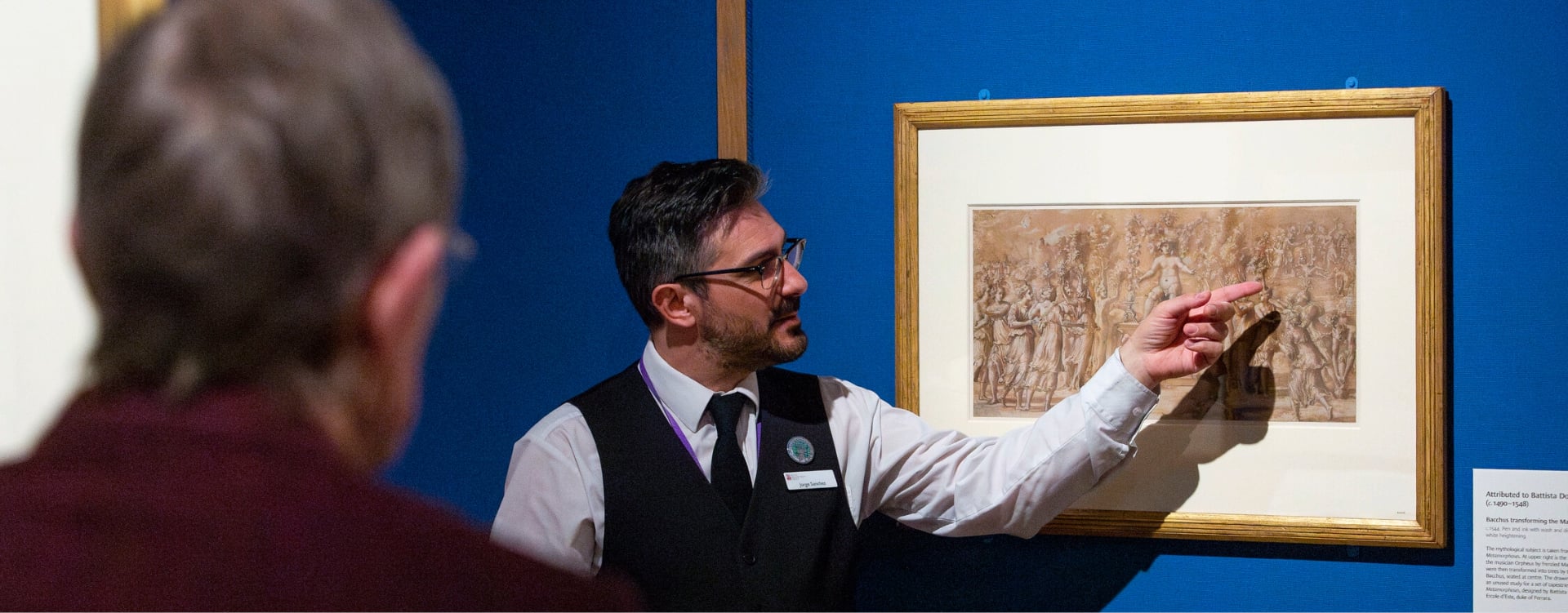 A member of staff pointing at a drawing whilst delivering a short talk 