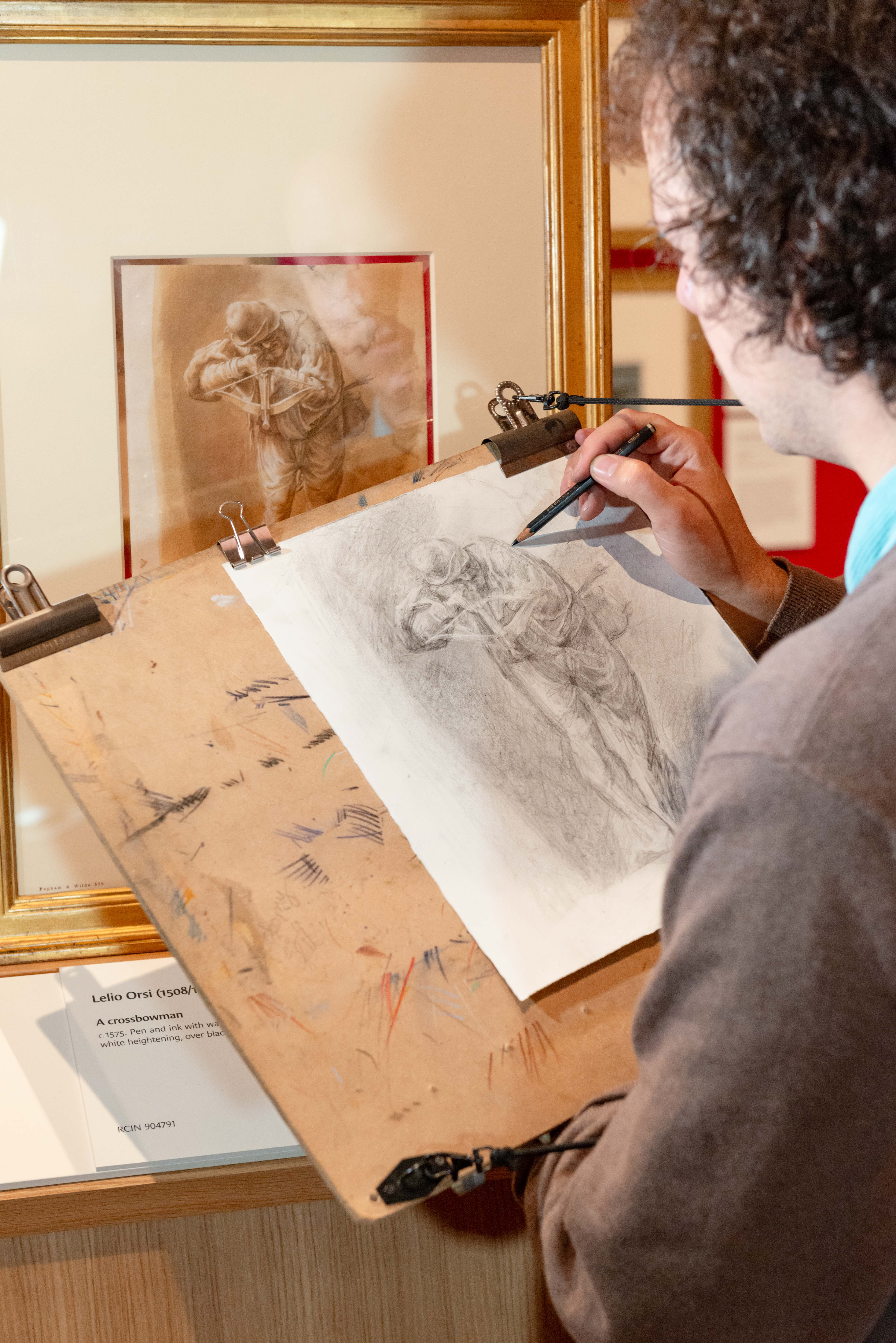 One of the artists in residence drawing from a Renaissance drawing in the Gallery