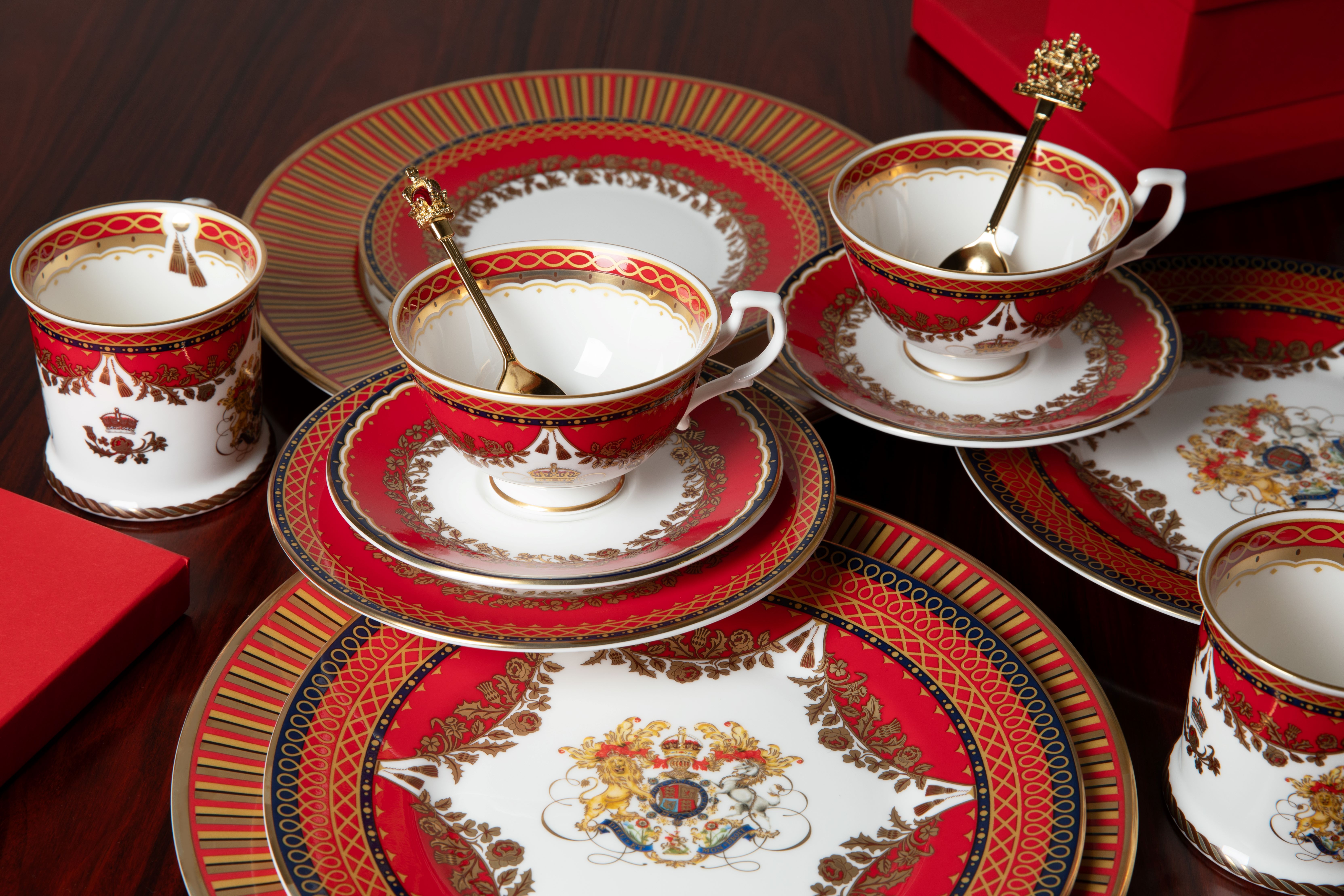 A selection of plates, teacups and saucers decorated in red, black and white