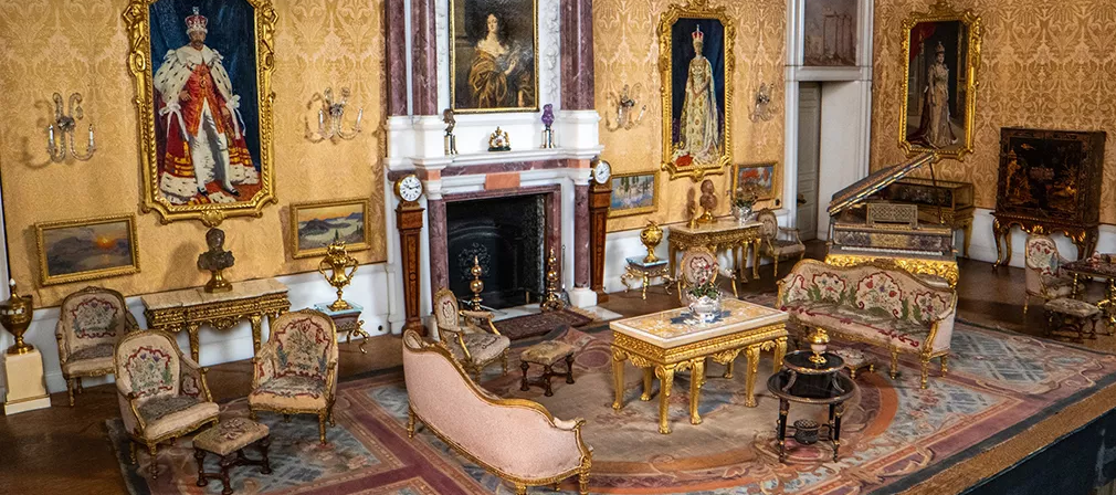 The Saloon in Queen Mary's Dolls' House, featuring the sofas which inspired the motif for this course.