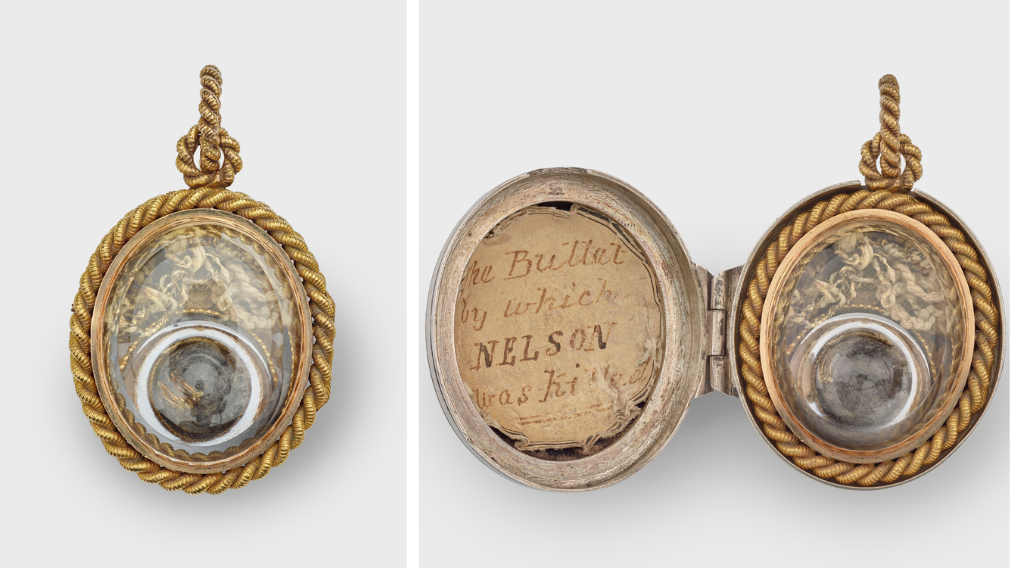 The Nelson Bullet, 1805 (RCIN 61158) A single lead shot or musket ball, mounted, with some remnants of gold lace from Admiral Nelson's uniform, beneath glass in a hinged silver locket with a gilt-metal ropework border and suspension loop.