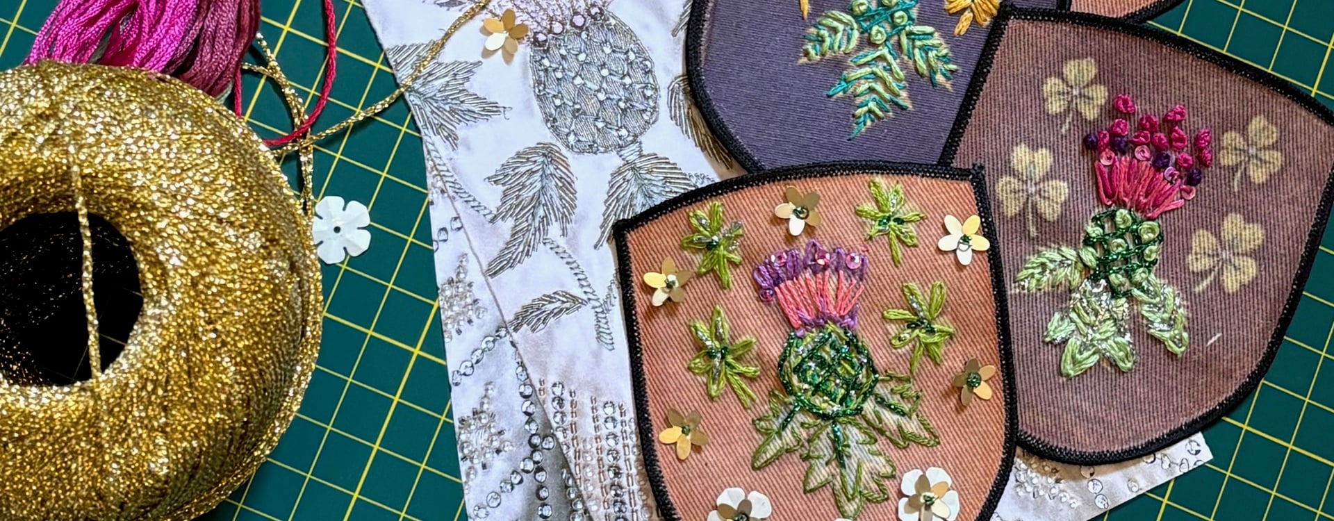 Image showing some of the completed patches, along with gold thread and loose sequins