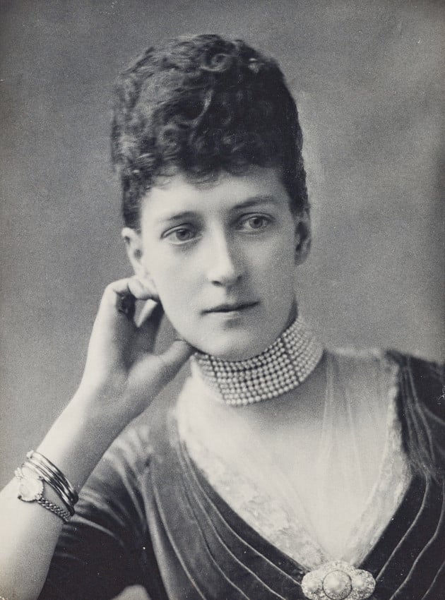 Lafayette, Alexandra, Princess of Wales, c. 1887 (RCIN 2941847) Half length portrait of the Alexandra, Princess of Wales, facing front, her right elbow resting on arm of chair. She wears 9-row pearl choker.