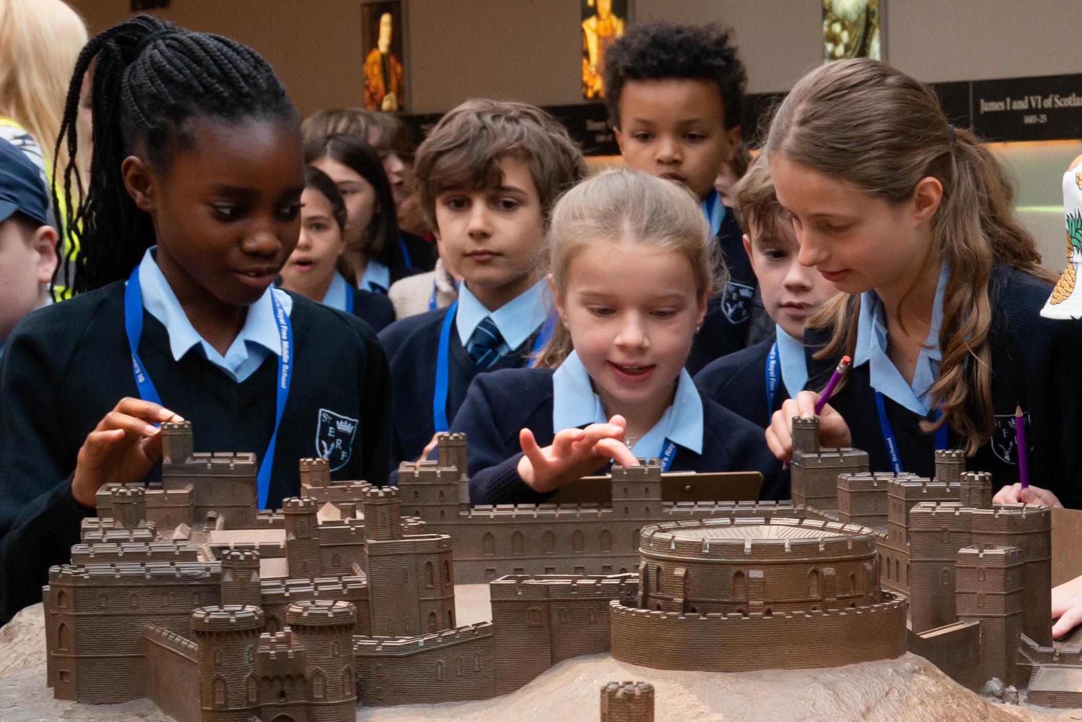 Children on a self-guided visit look at a model of Windsor Castle. 