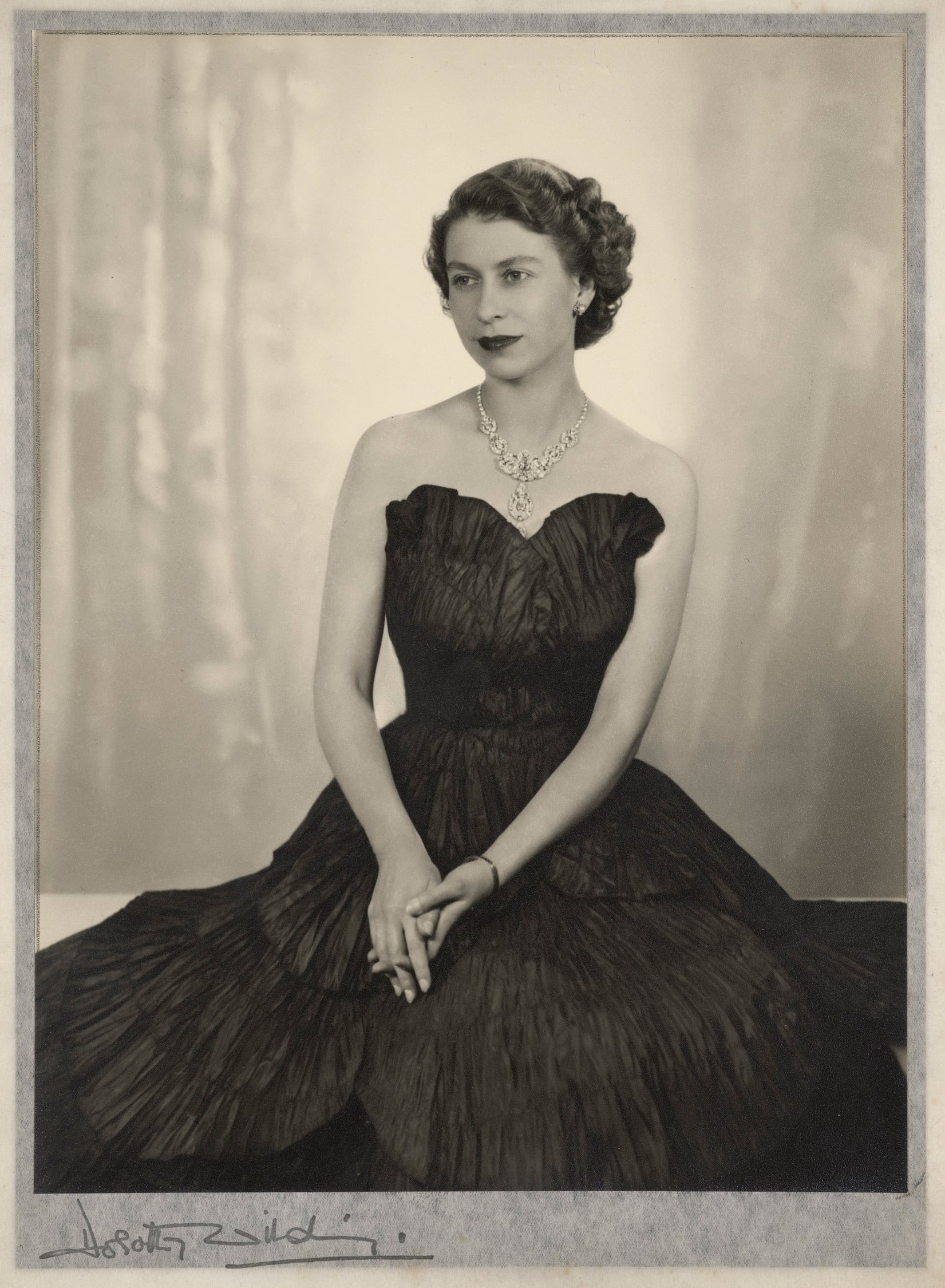 Queen Elizabeth II (RCIN 2416689) Black and white photo of woman in black dress