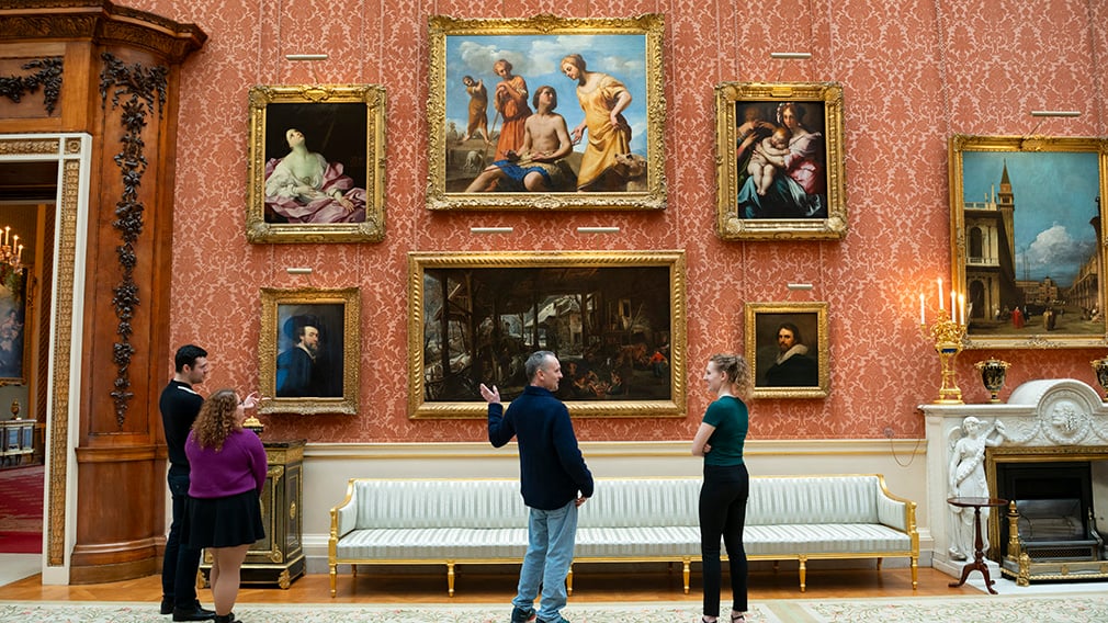 The Picture Gallery at Buckingham Palace People looking at paintings on the wall.