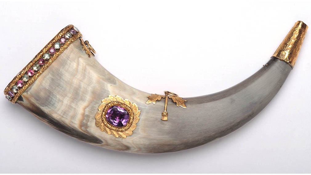 A flask made from horn with gold fittings and large gold mounted amethyst.